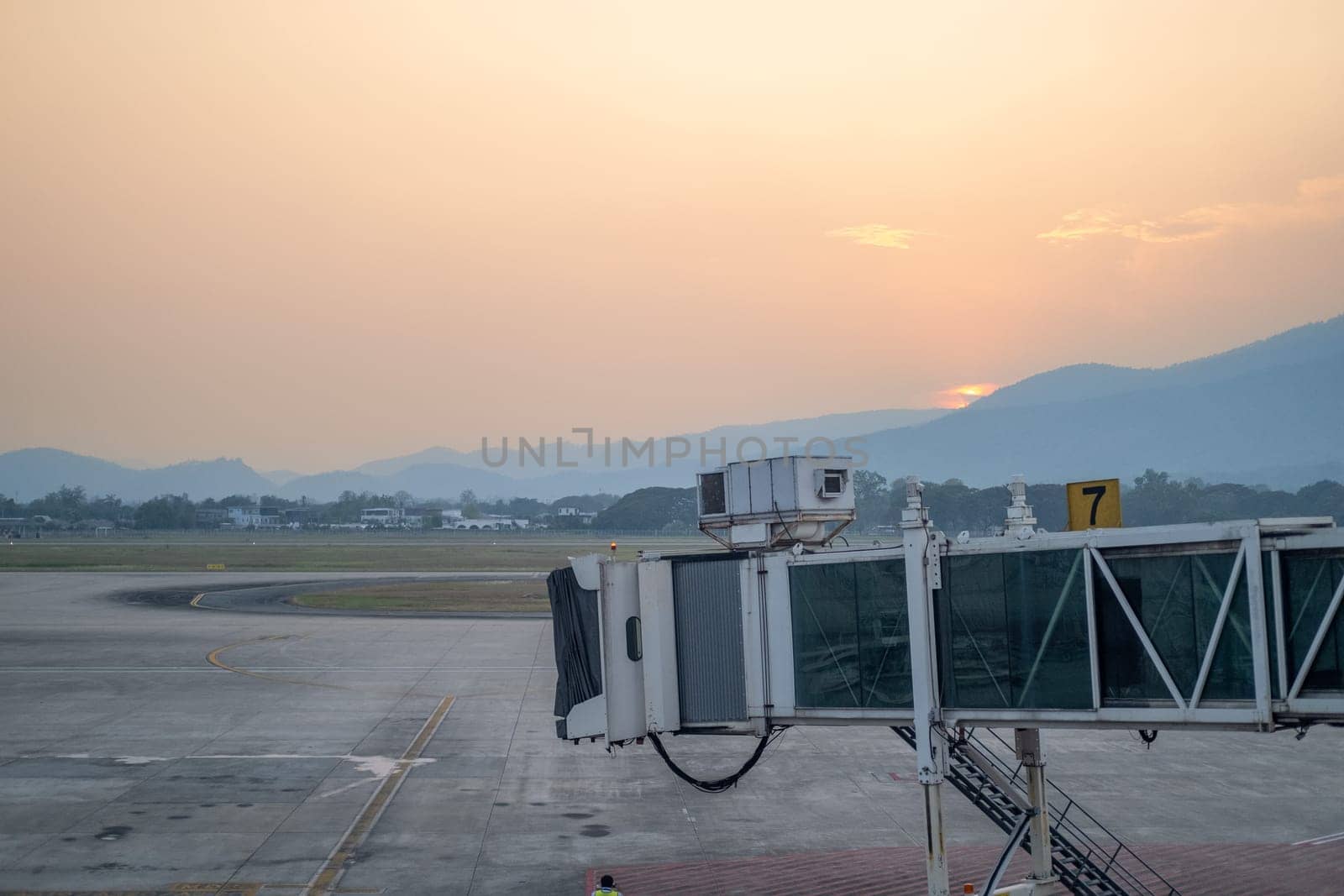 Aerobridge for support passenger to aircraft, Aero bridge at parking bay, aerobridge walkway coridoor, transport to aircraft, boarding way. High quality photo