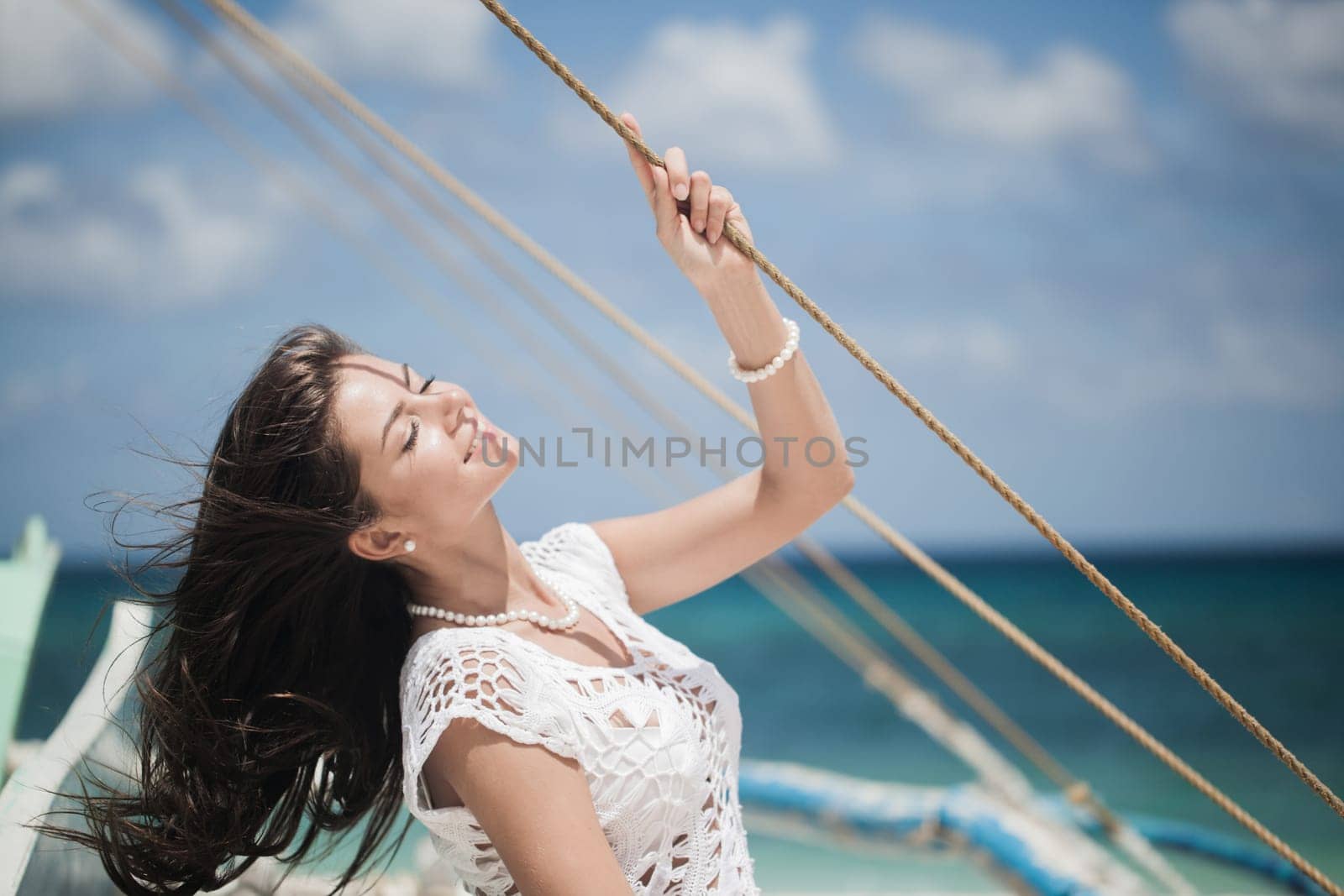 Happy woman on boat enjoy sailing by Yellowj