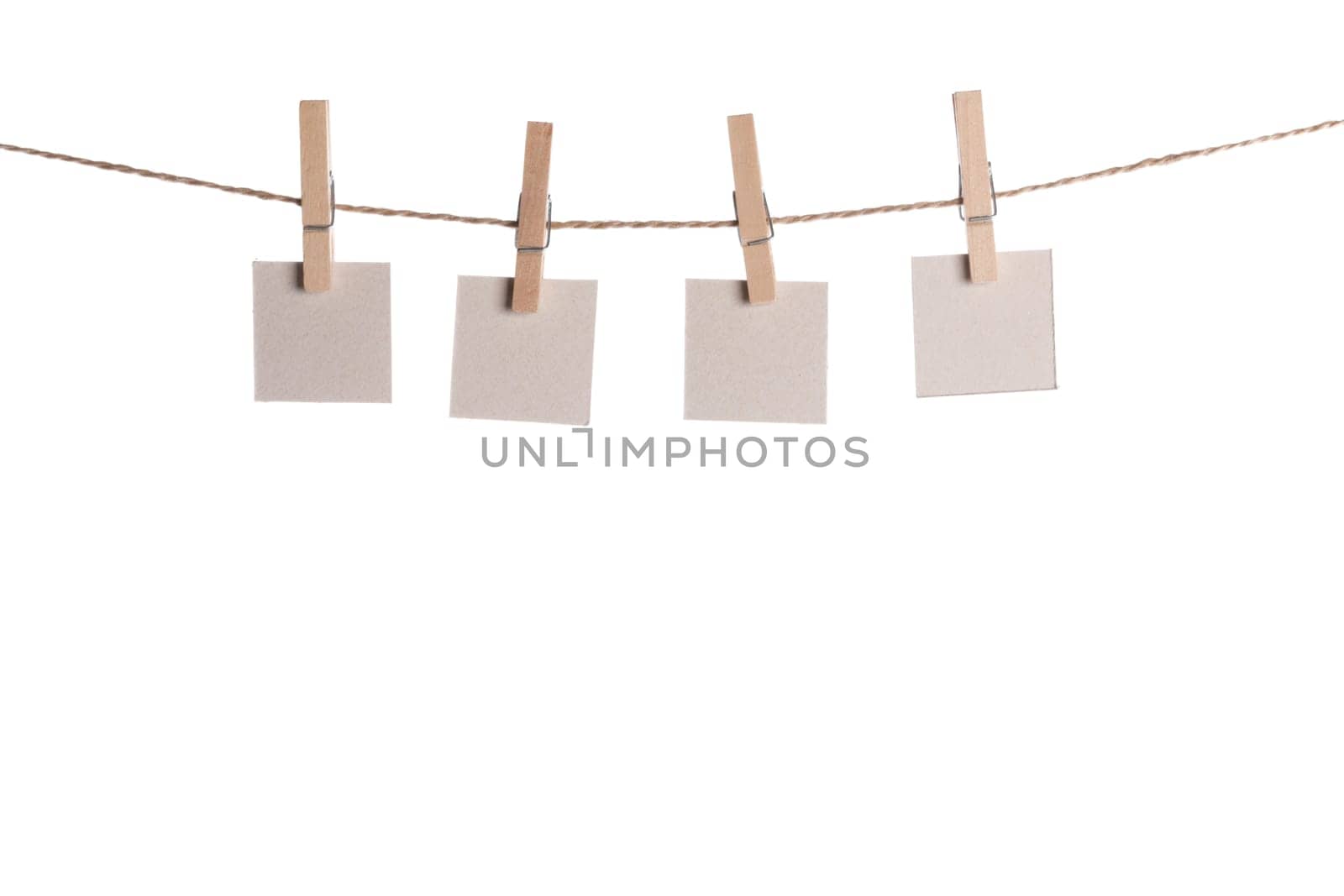 Set of blank notes held on string isolated by Yellowj