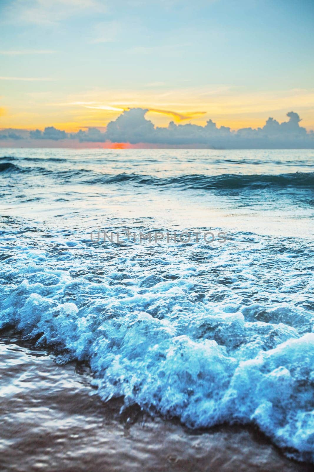 Beach sunrise or sunset over the tropical sea and sky with clouds