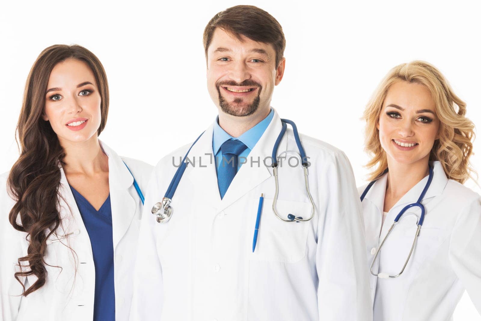 A medical team of doctors, man and women, isolated on white background