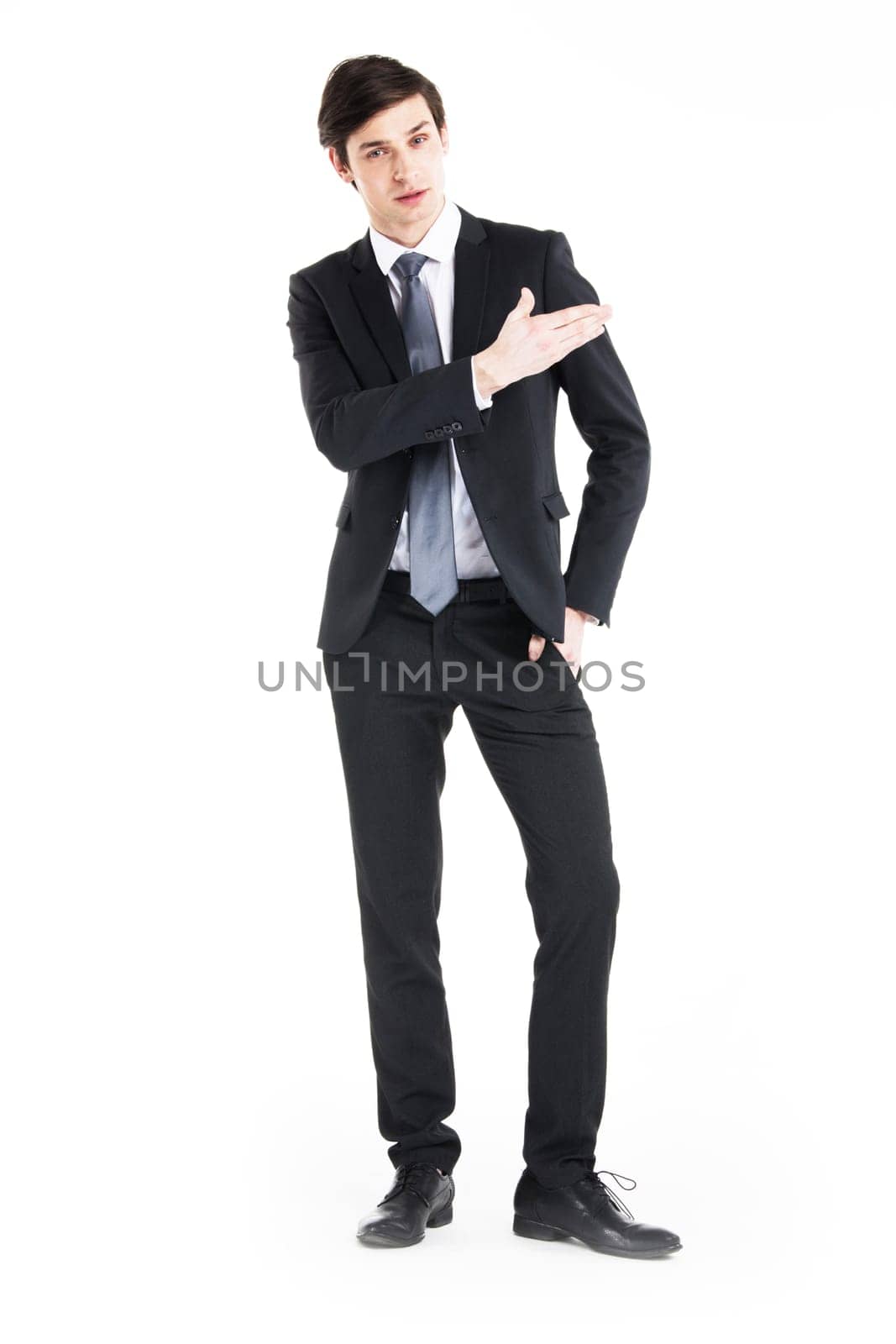 Business man shows you copy space isolated on white background
