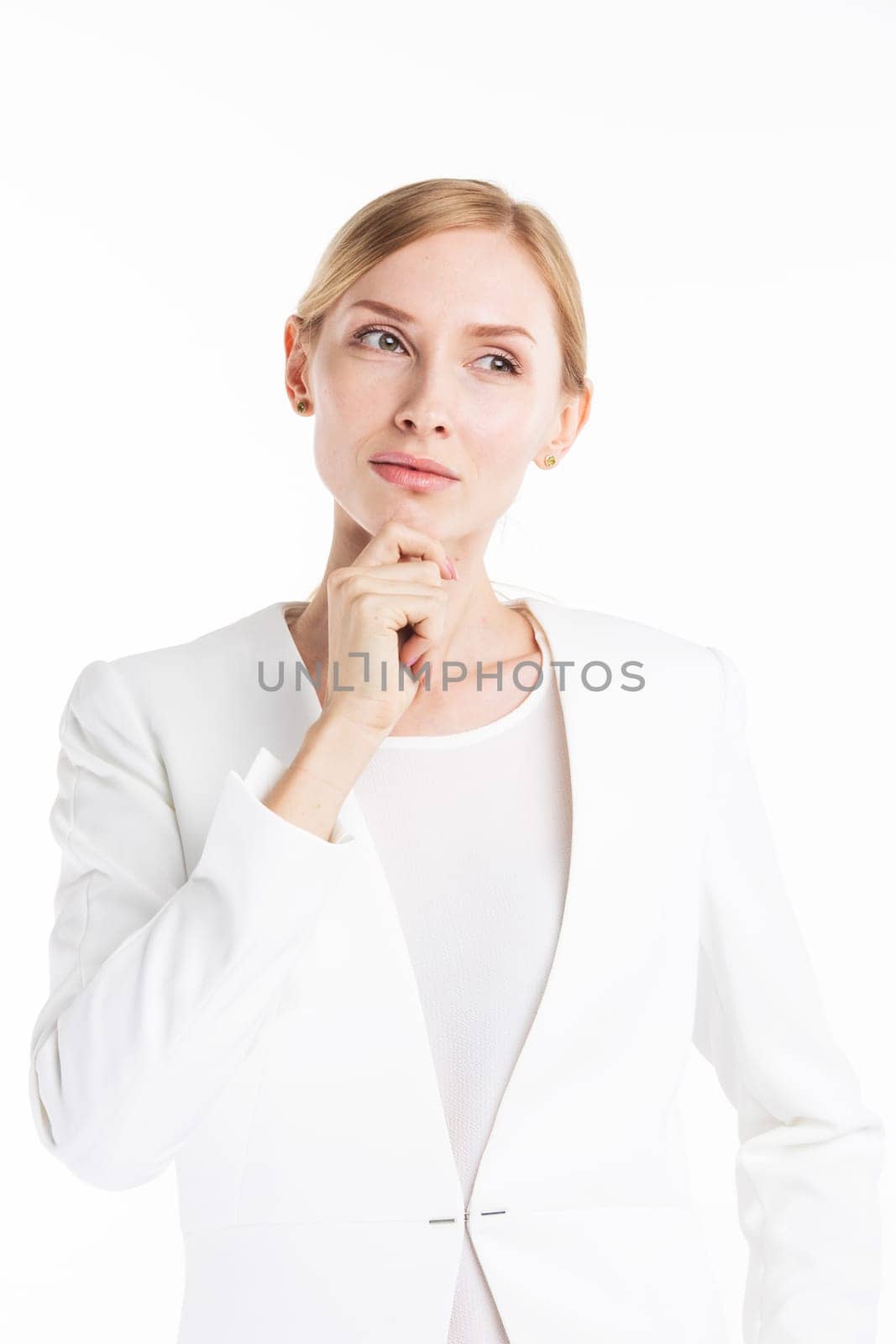 Portrait of mature pensive business woman in white suit isolated on white background
