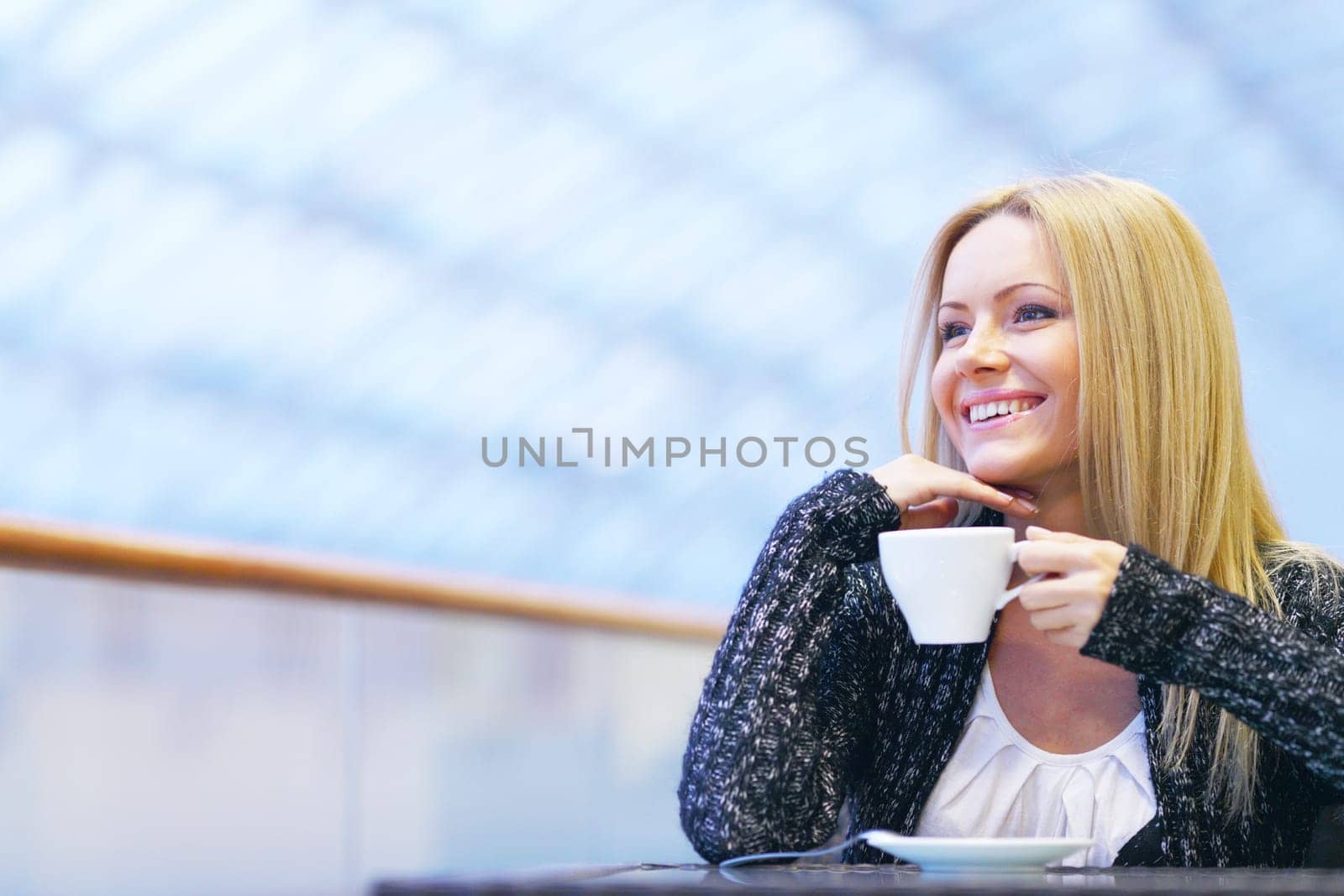  young woman drink coffee on modern background