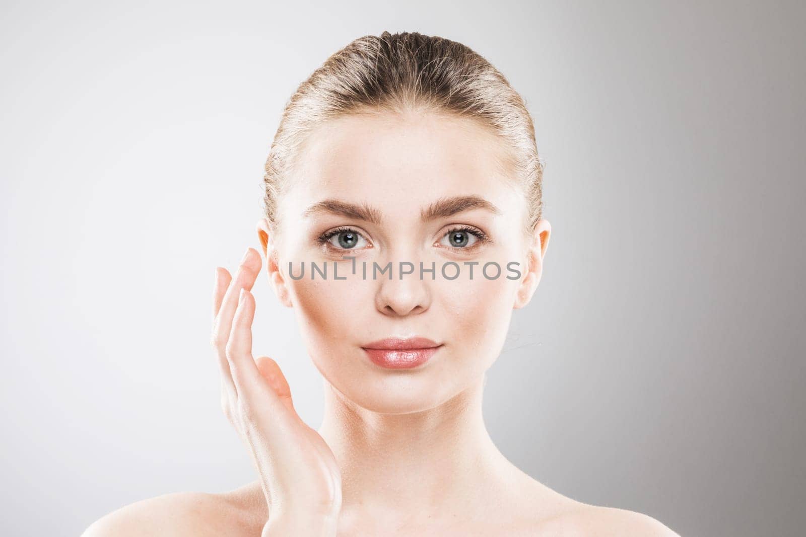 Beauty woman face portrait. Beautiful spa model girl with perfect fresh clean skin. Female looking at camera. Youth and skin care Concept