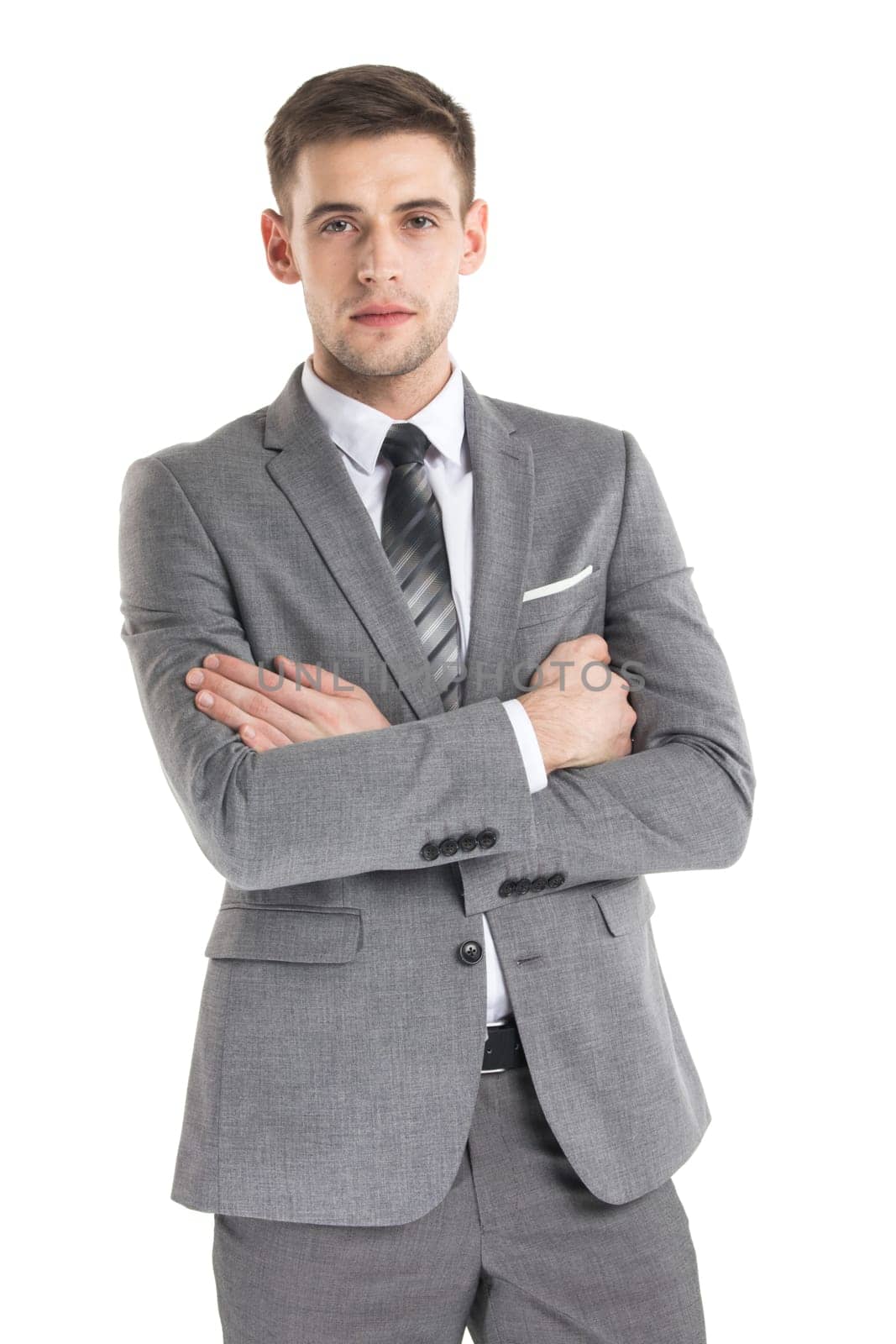 Portrait of a handsome young businessman in suit over white background