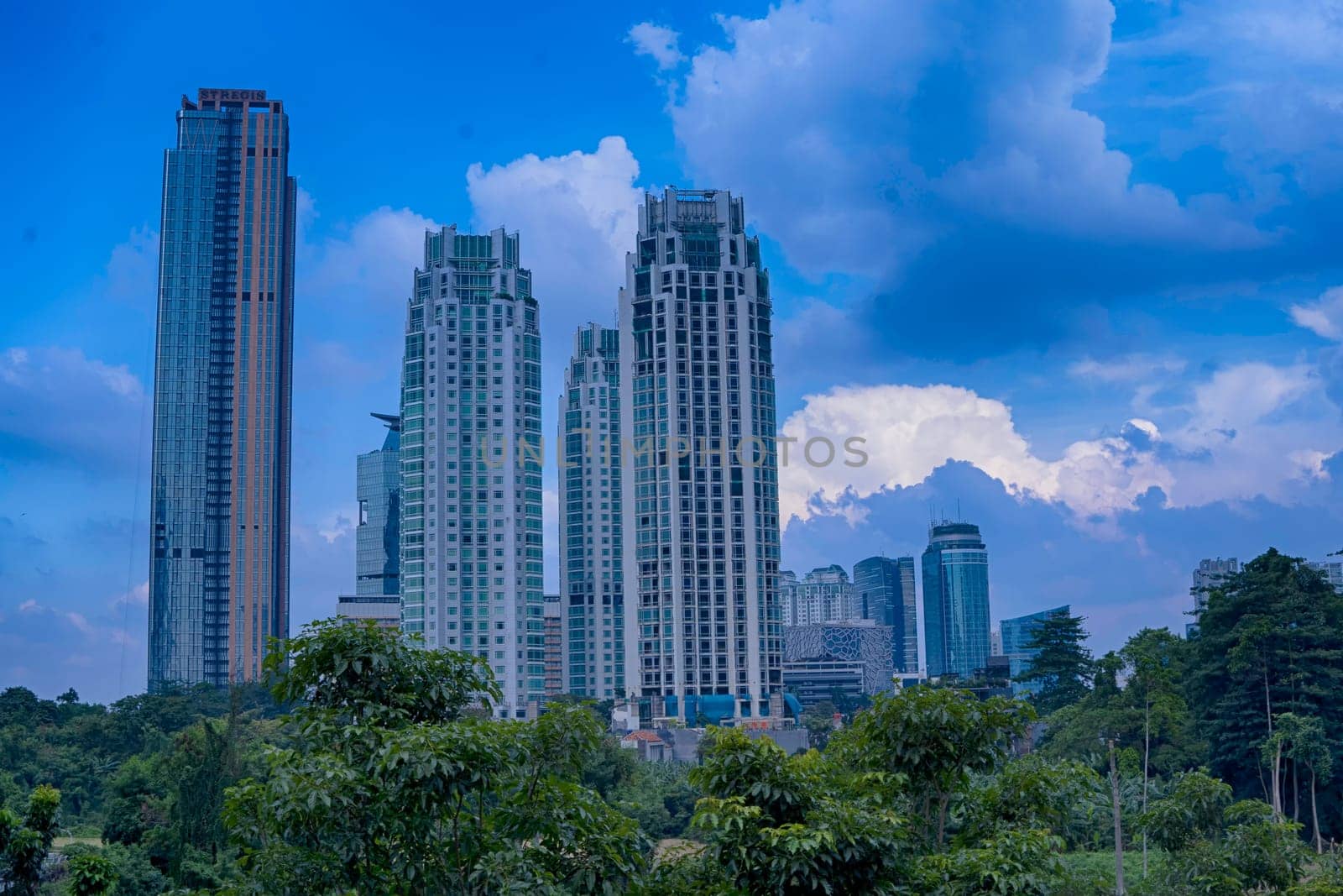 Jakarta, Indonesia. April 23, 2023. The street with high buildings and the light traffic during Eid Holidays. Street Photography.