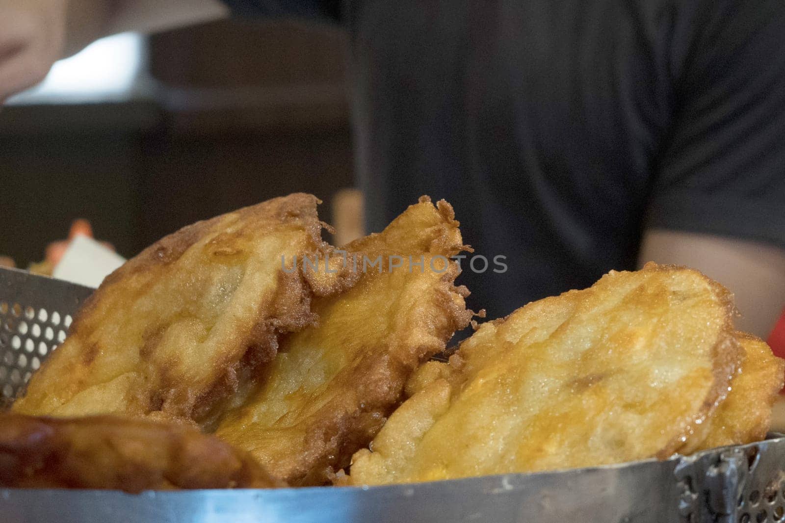 The fried cempedak which is the fruit similar with jackfruit but with strong smell and softer. Covered with flour. Food photography.