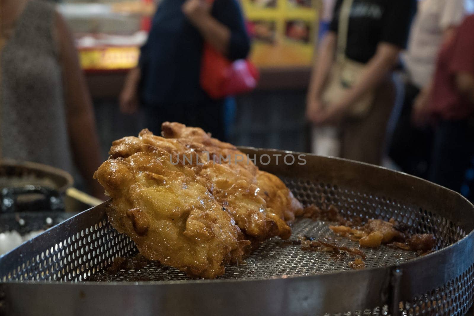 The fried cempedak which is the fruit similar with jackfruit but with strong smell and softer. Covered with flour. Food photography.