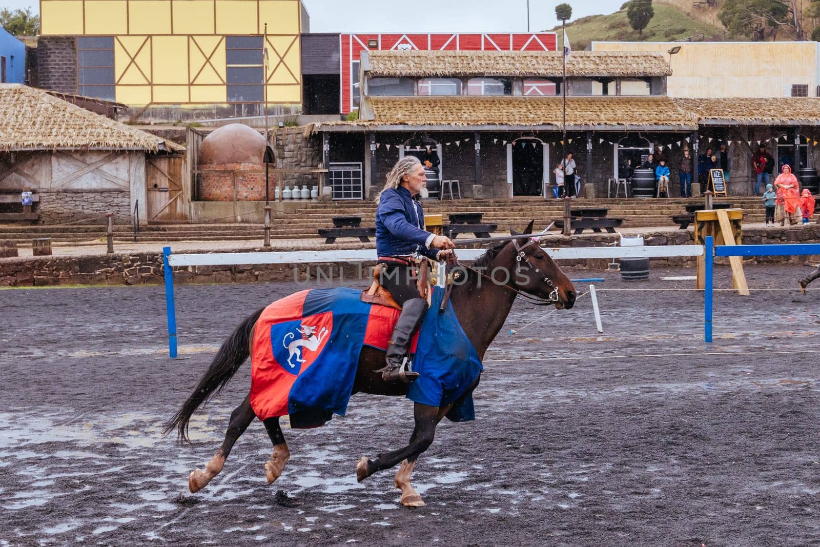 BALLARAT, AUSTRALIA - April 7 2023: Medieval horse show at the popular tourism destination of Kryal Castle which is a medieval village near the country Victorian town of Ballarat on a stormy autumn morning
