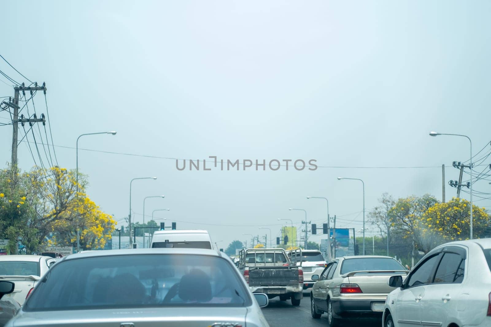 Concept of Air pollution PM2.5 Unhealthy toxic dust haze spread in road city by wuttichaicci