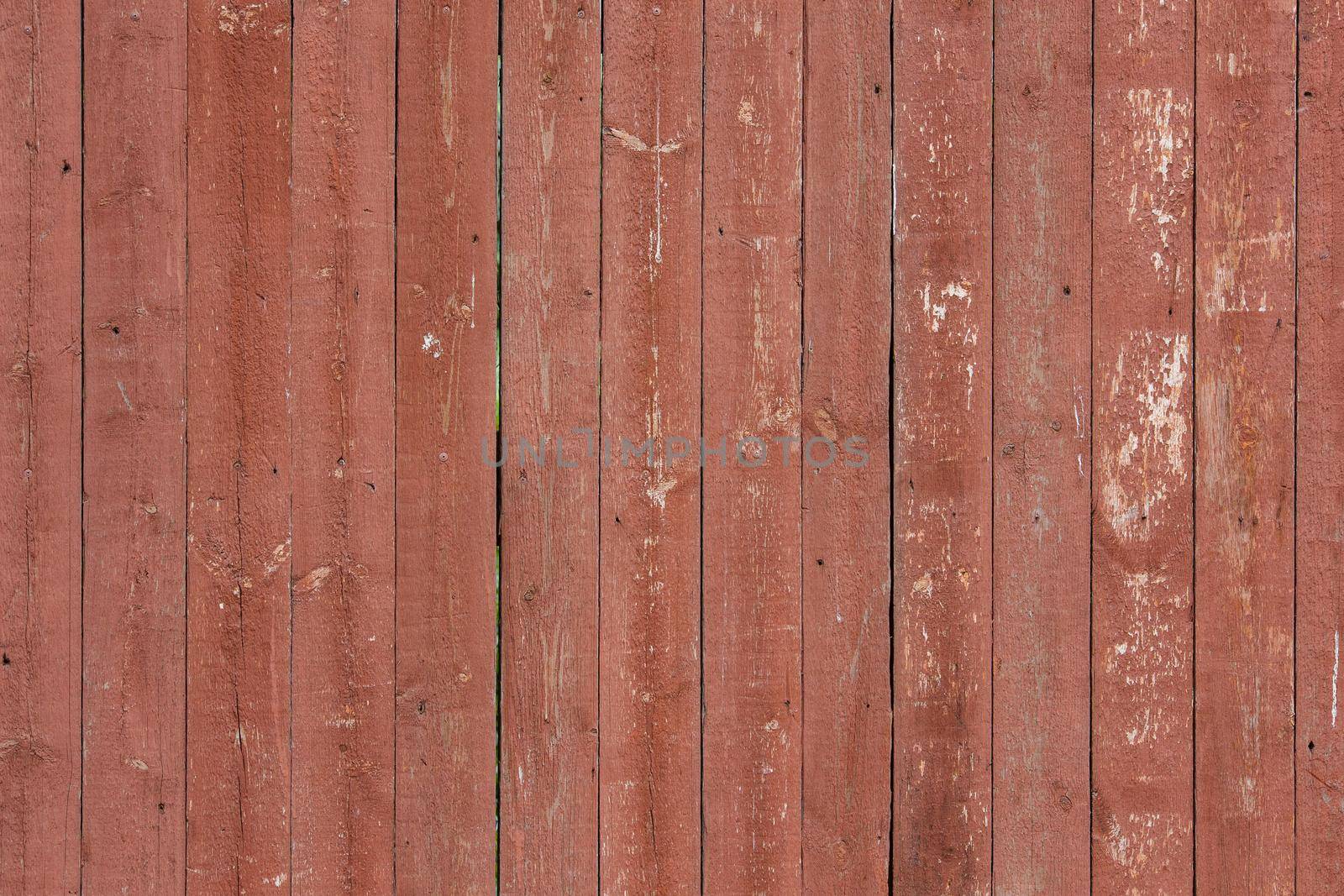 close-up full frame background and texture of brown painted wood fence or shed wall with vertical planks pattern
