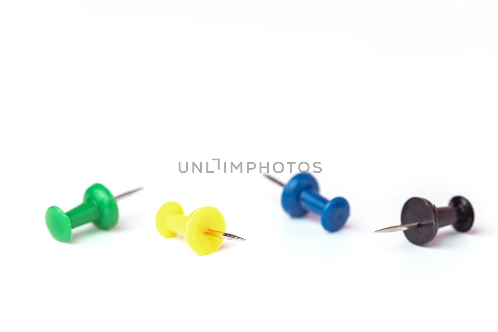 Push pins on white background for the concept of office and school stationary object.