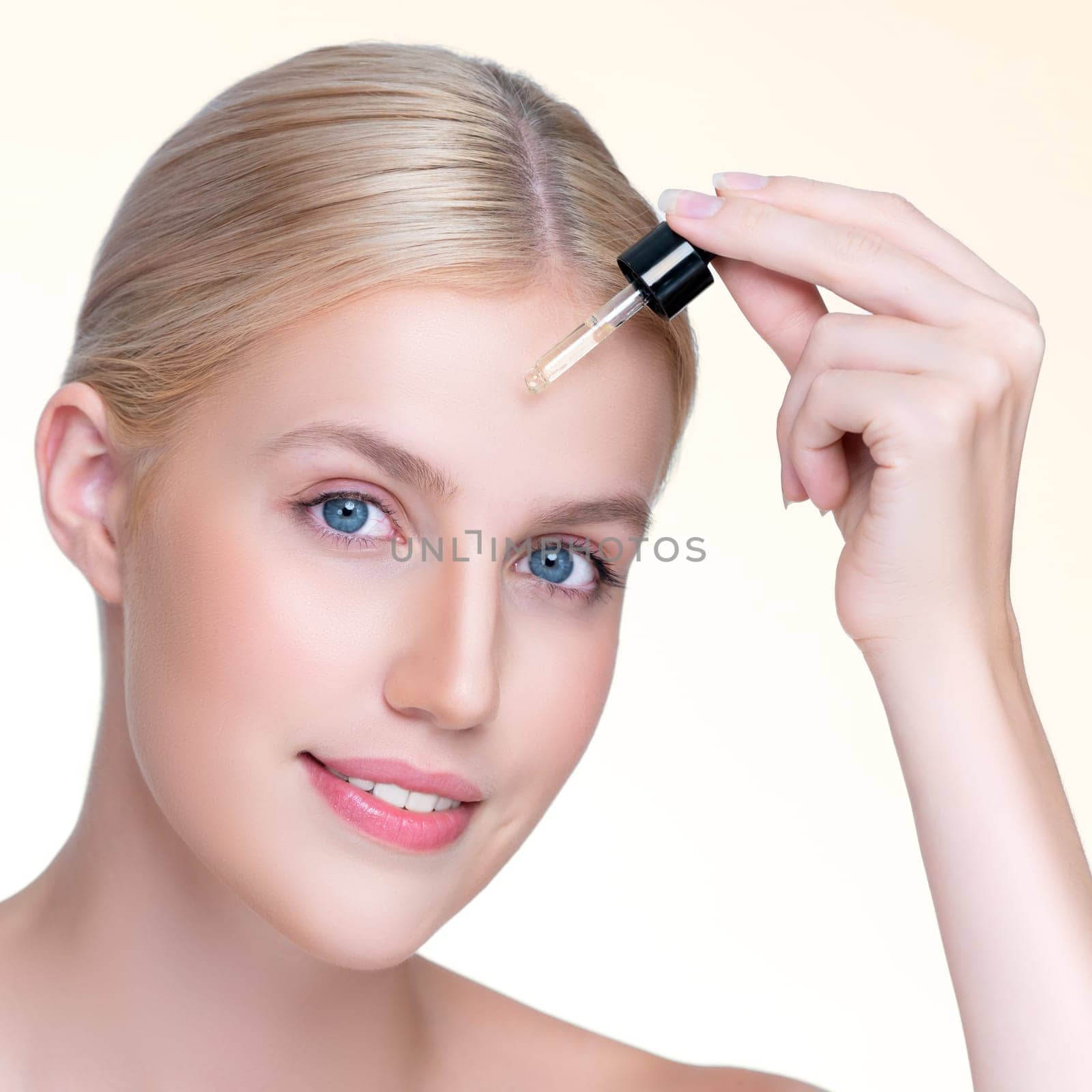 Closeup personable portrait of beautiful woman applying essential oil bottle for skincare product. Cannabis extracted CBD oil dropper for treatment and cannabinoids concept in isolated background.