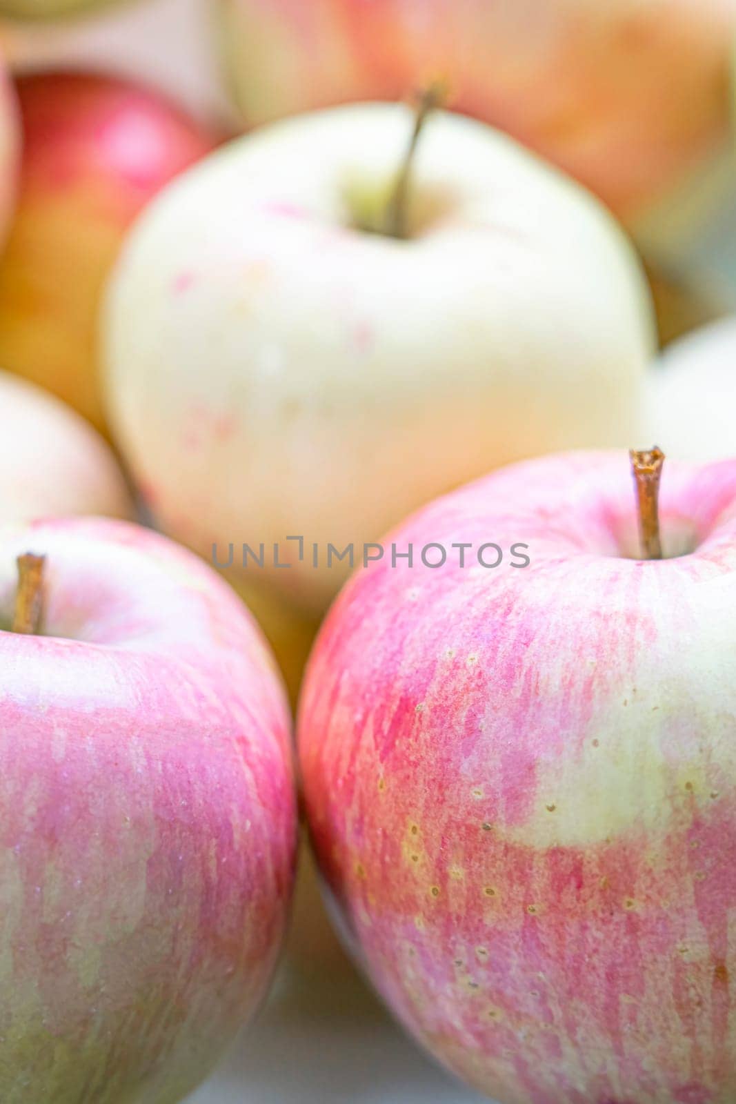 ripe red-yellow apple fruits on a plate close-up macro. photo