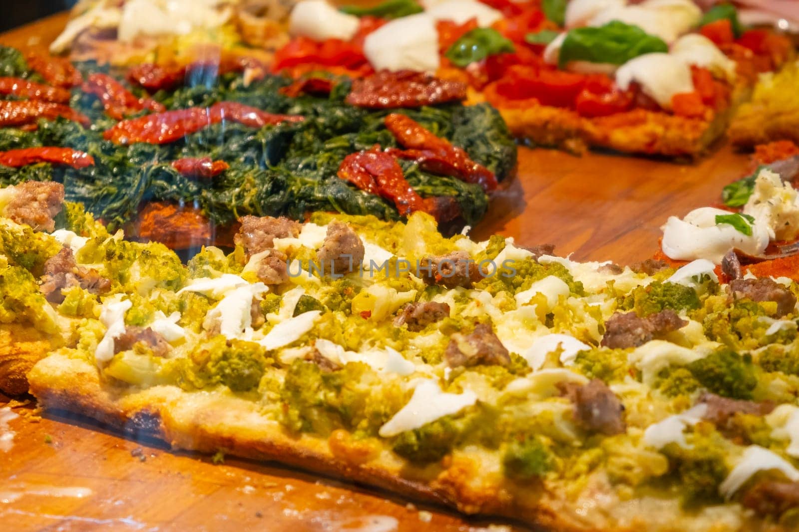 Tasty pizza with broccoli, meat, and cheese for sale