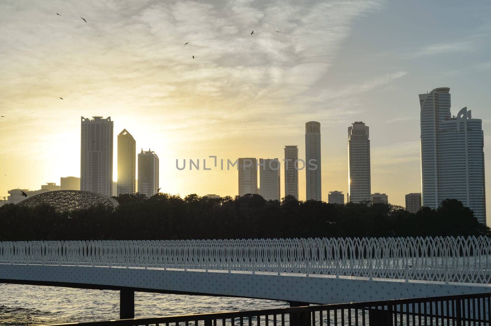 Night landscape of the embankment of the emirate of Sharjah, United Arab Emirates.