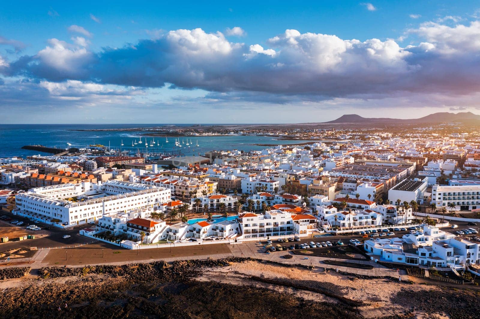 Corralejo aerial cityscape, port city in Fuerteventura, beautiful panoramic view of Canary islands, Spain. Panoramic aerial view of Corralejo town on Fuerteventura island, Canary Islands, Spain.