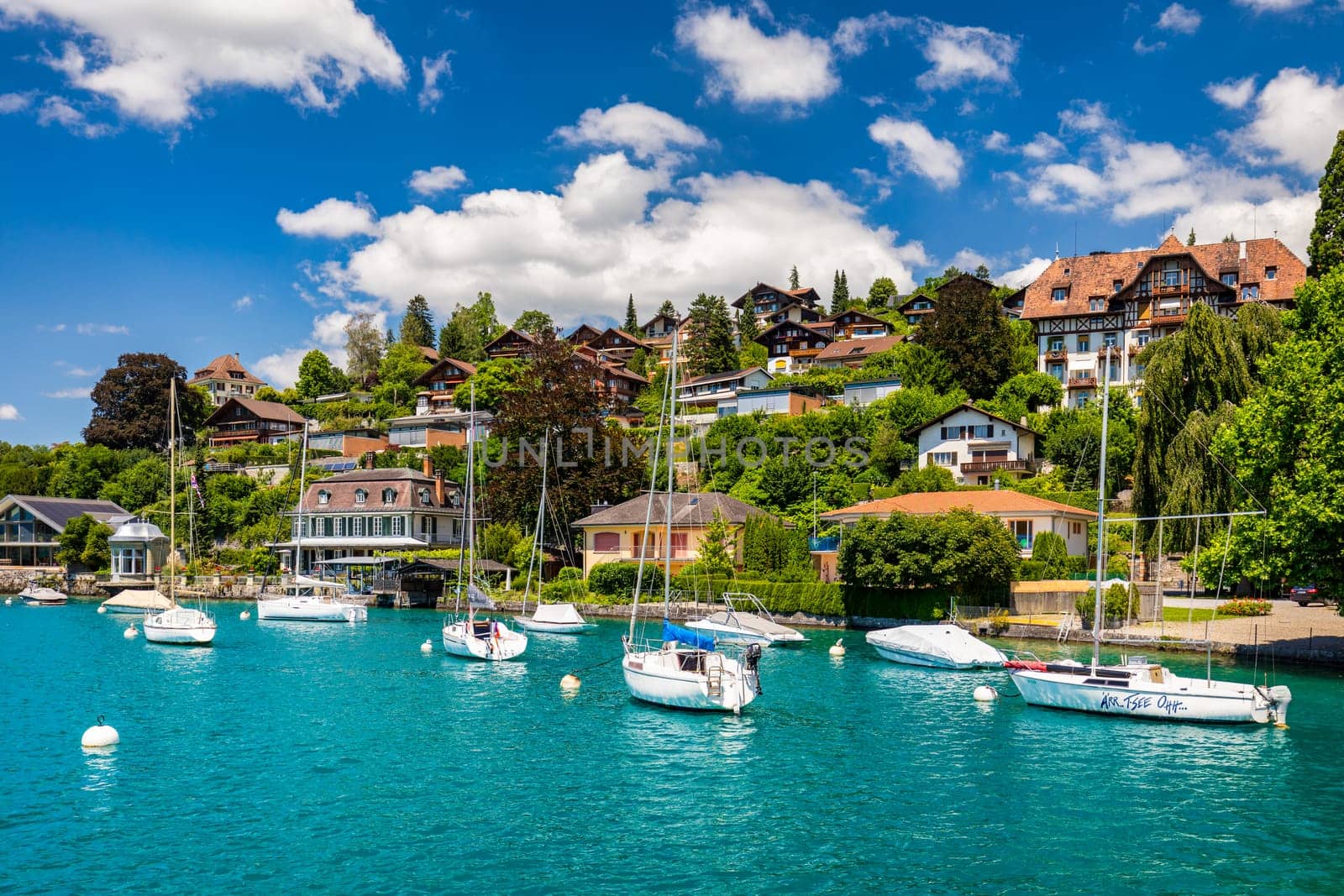 Oberhofen town at Lake Thunersee in swiss Alps, Switzerland. Oberhofen city on the Lake Thun (Thunersee) in Bern Canton of Switzerland. Oberhofen on Lake Thun, Switzerland. 
