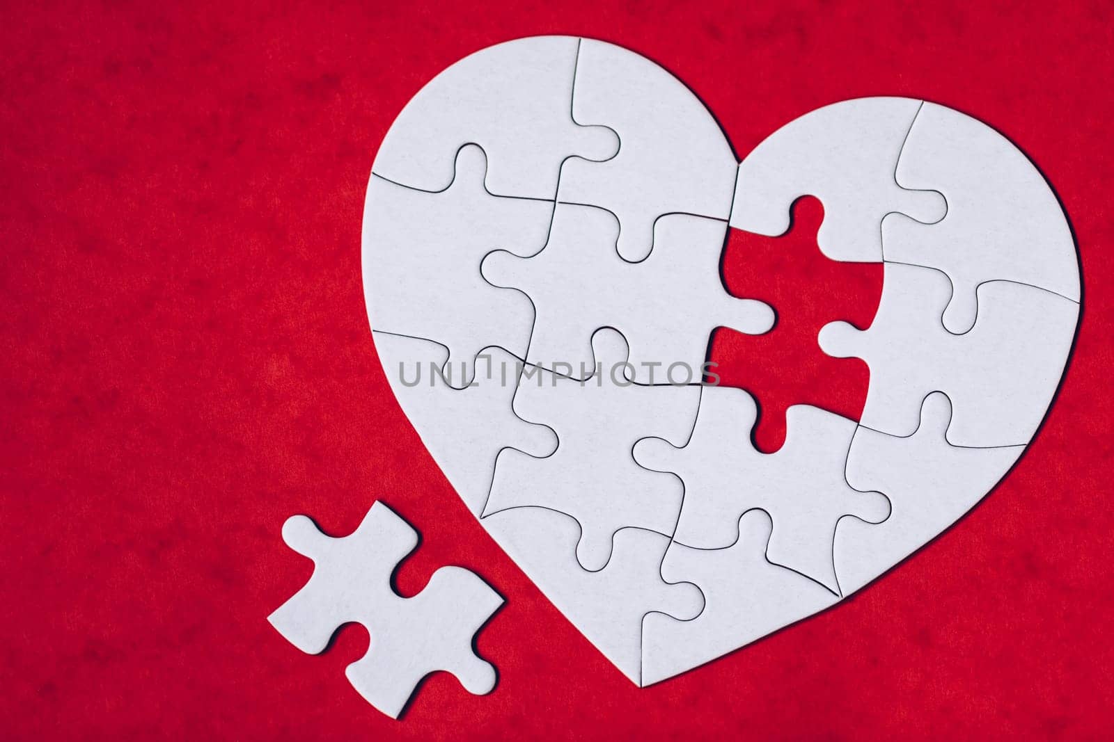 Heart object made of puzzle pieces. Make complete heart. Jigsaw puzzle pieces in form of heart. Happy Valentines Day, greeting card template. Heart jigsaw puzzle.