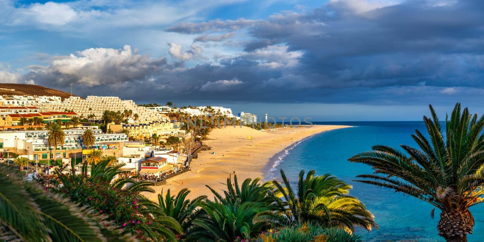 Morro Jable, Fuerteventura, Spain. Breathtaking beach Playa del Matorral in the rays of the sunset. Morro Jable and Playa del Matorral, Fuerteventura, Canary Islands, Spain, Atlantic, Europe