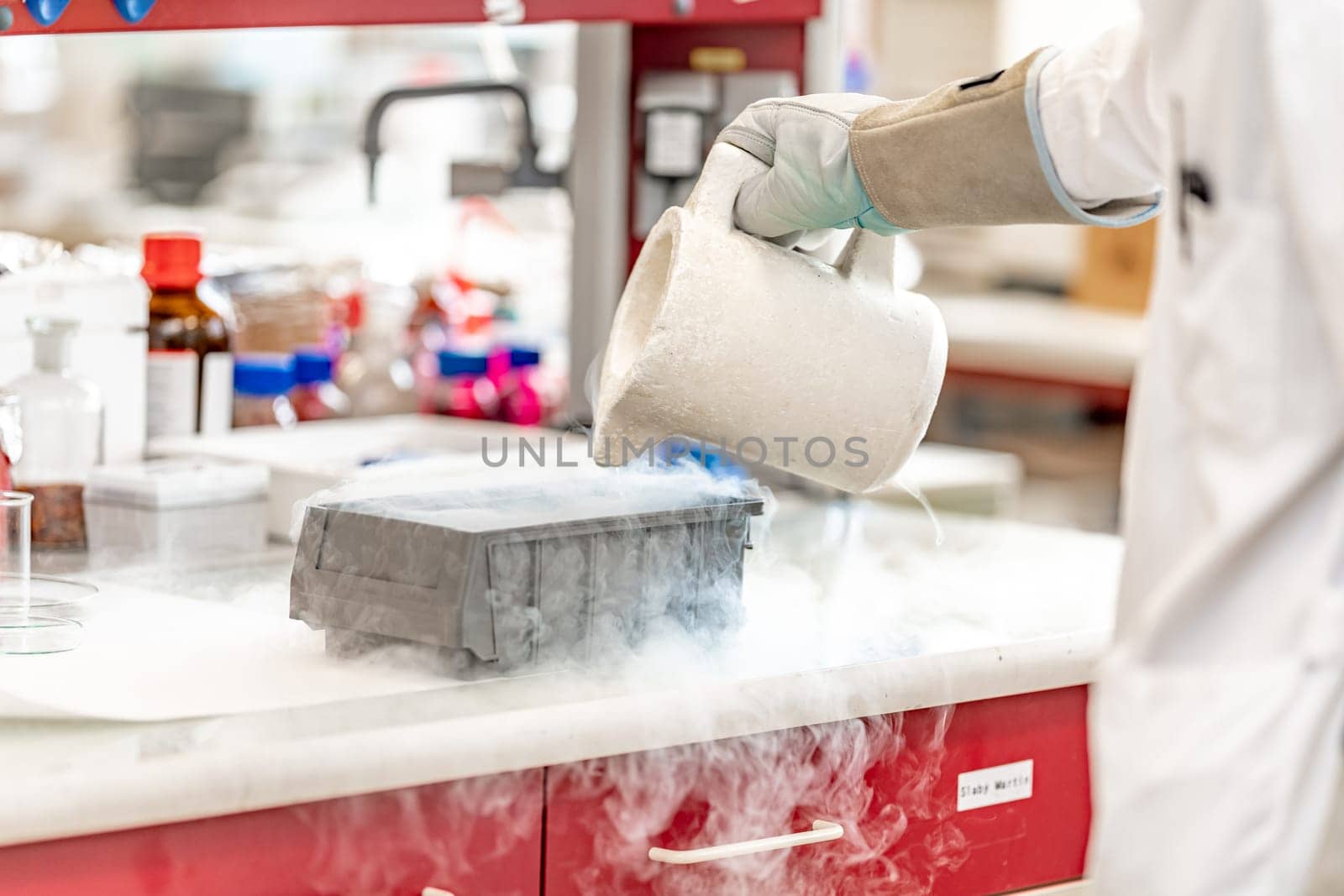 experiments with liquid nitrogen in the chemical laboratory. work and research with extreme temperatures by Edophoto