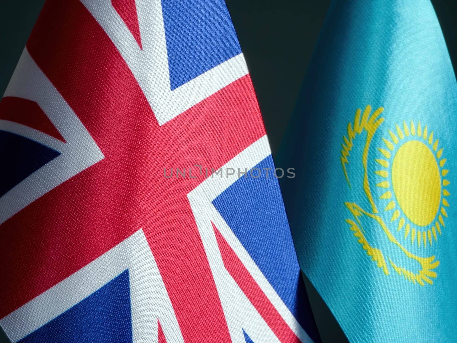 Close-up of the UK and Kazakhstan flags. by designer491