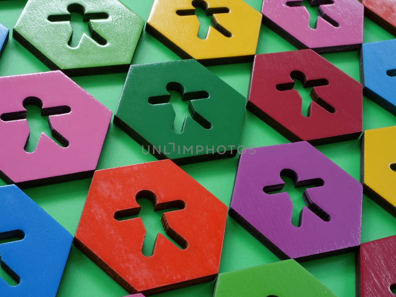 Multi-colored hexagons with figures. Cultural humility concept. by designer491