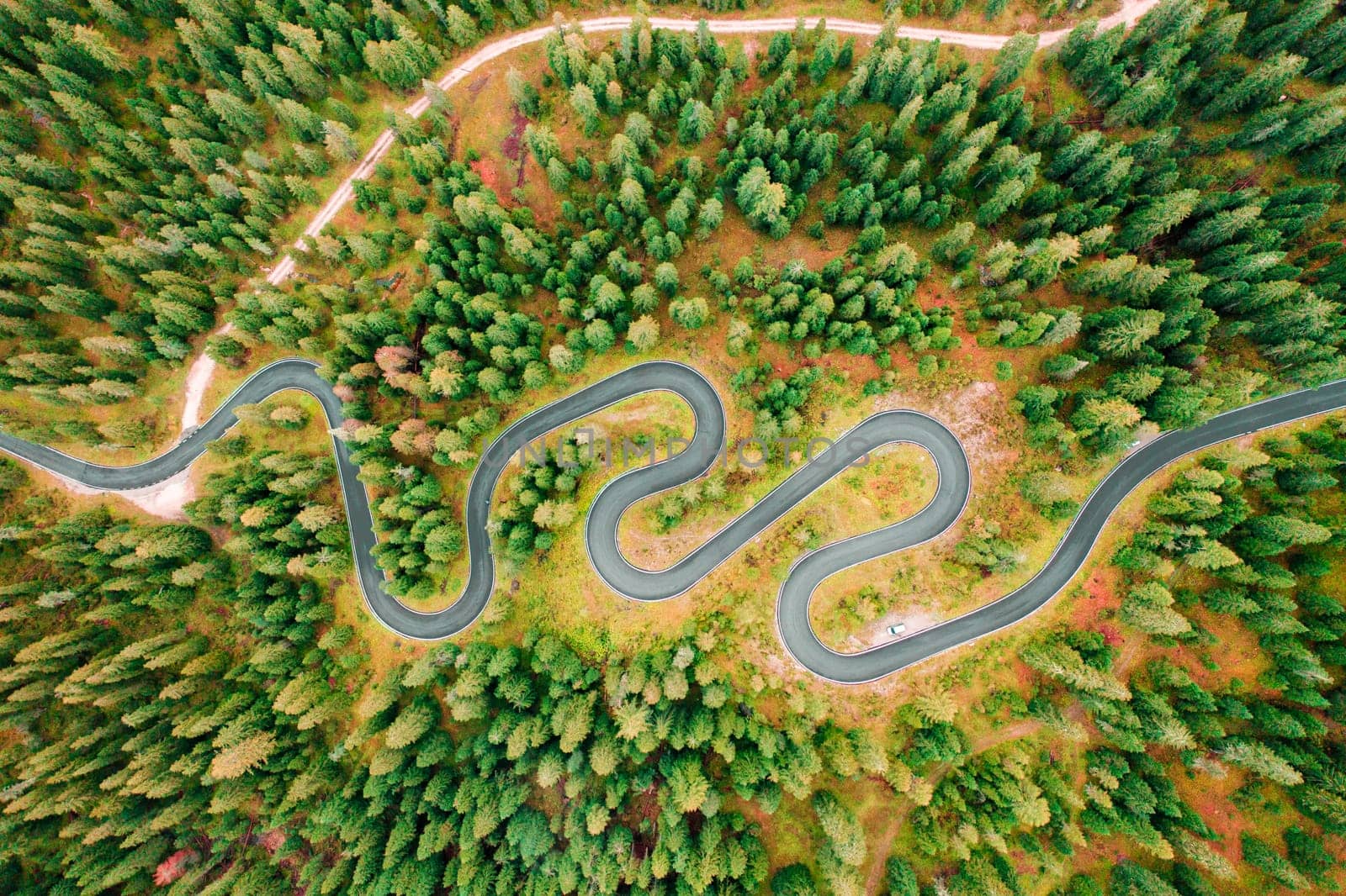 Snake Road meandering through the renowned Giau Pass, renowned for its natural beauty and stunning scenery.