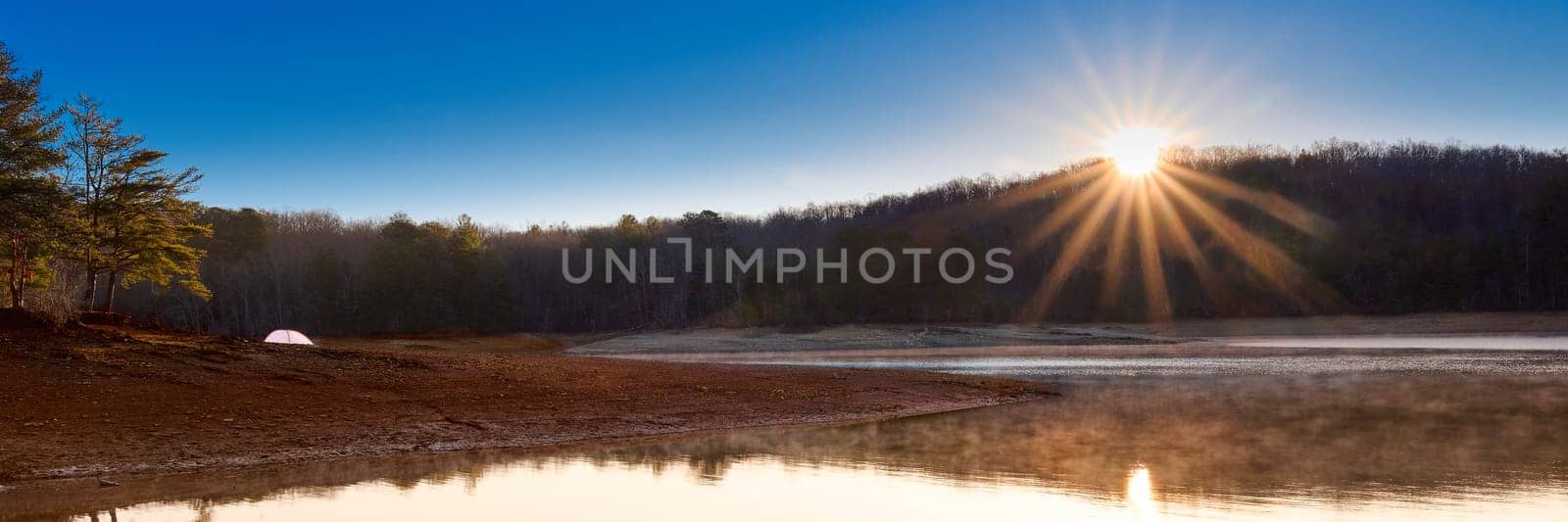 Sunrise on a tent along the shore of Lake Blue Ridge. Located at Morganton Point Campground in the Chattahoochee-Oconee  National Forest, GA.