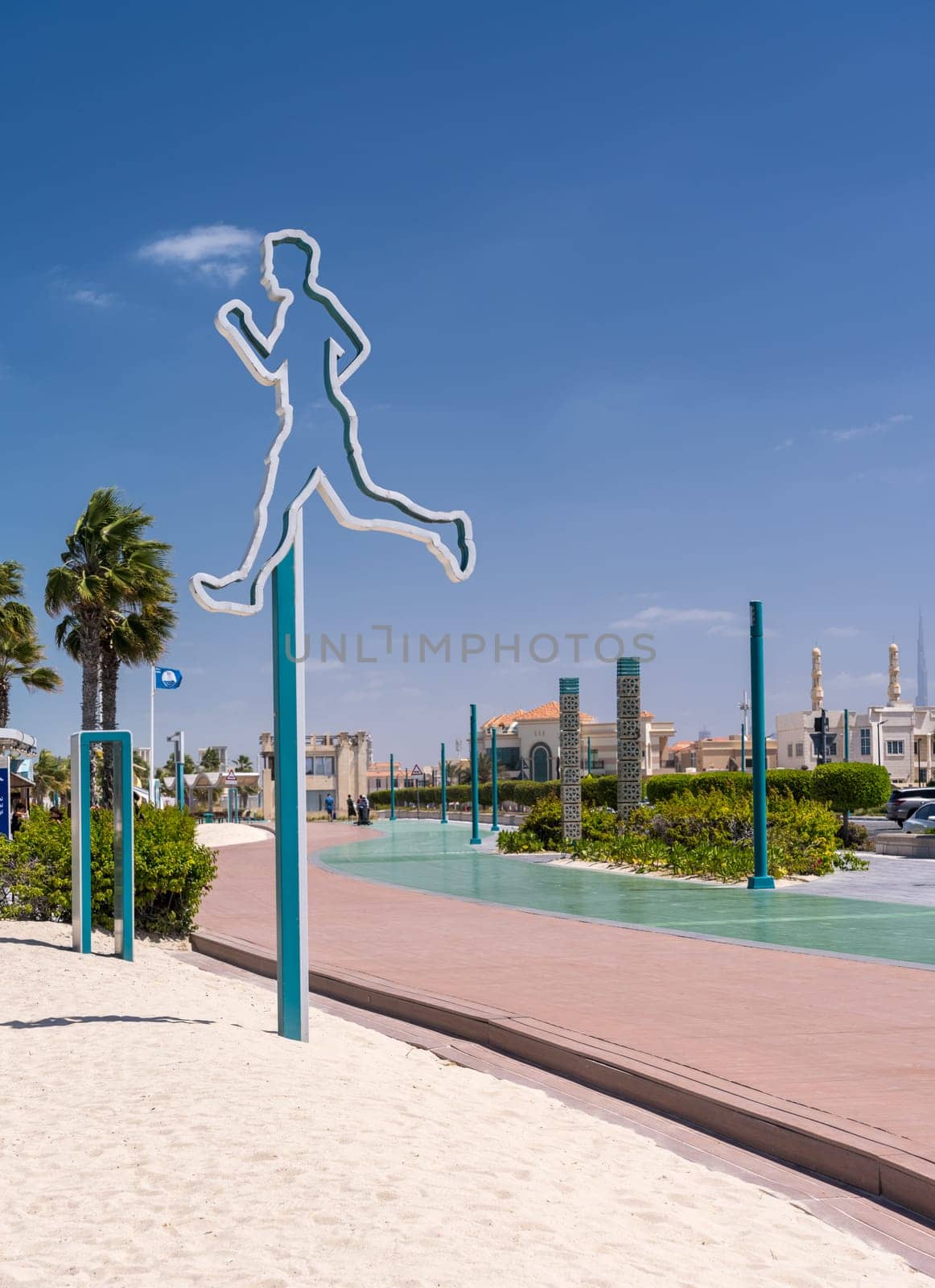 Rubber surface of running track alongside Dubai beach by steheap