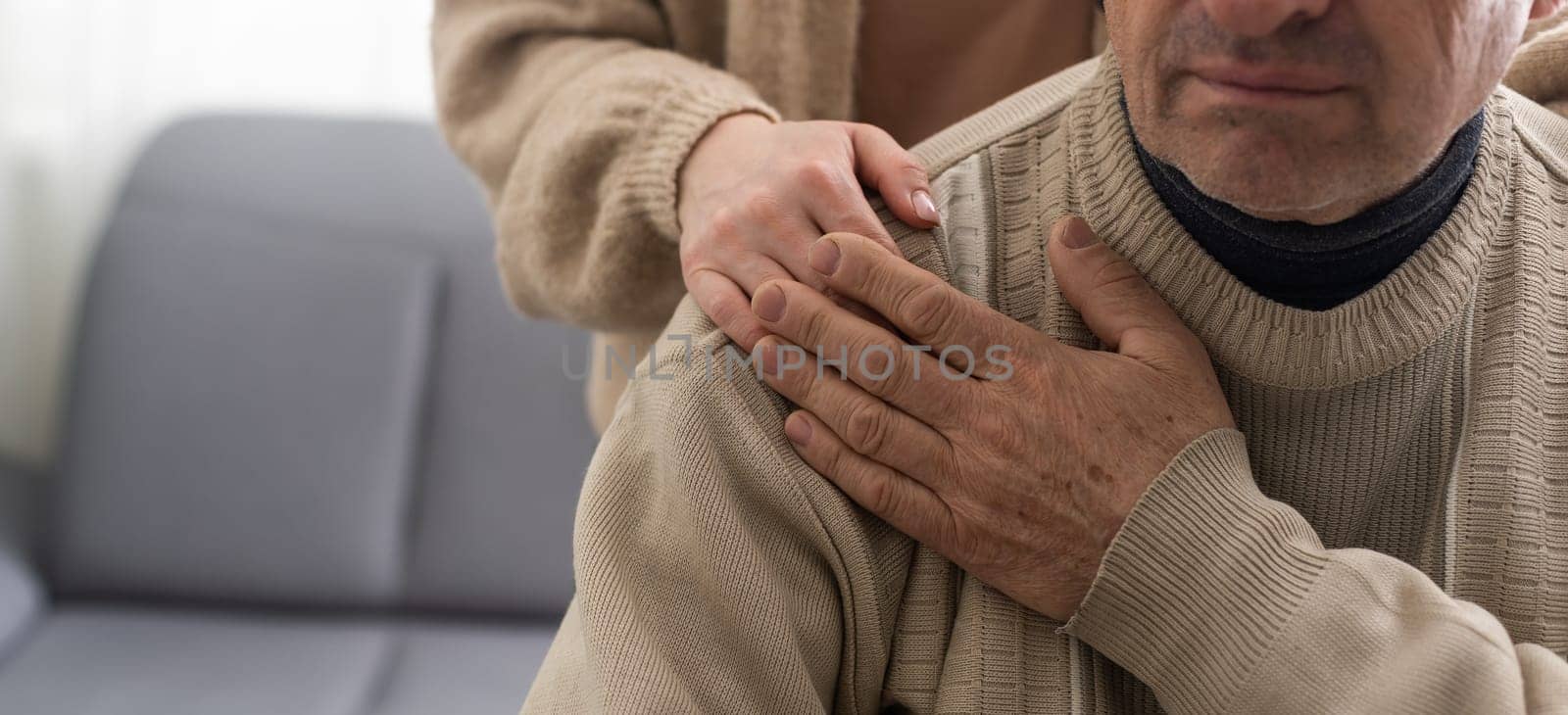 Two people holding hand together. elderly man and support woman.