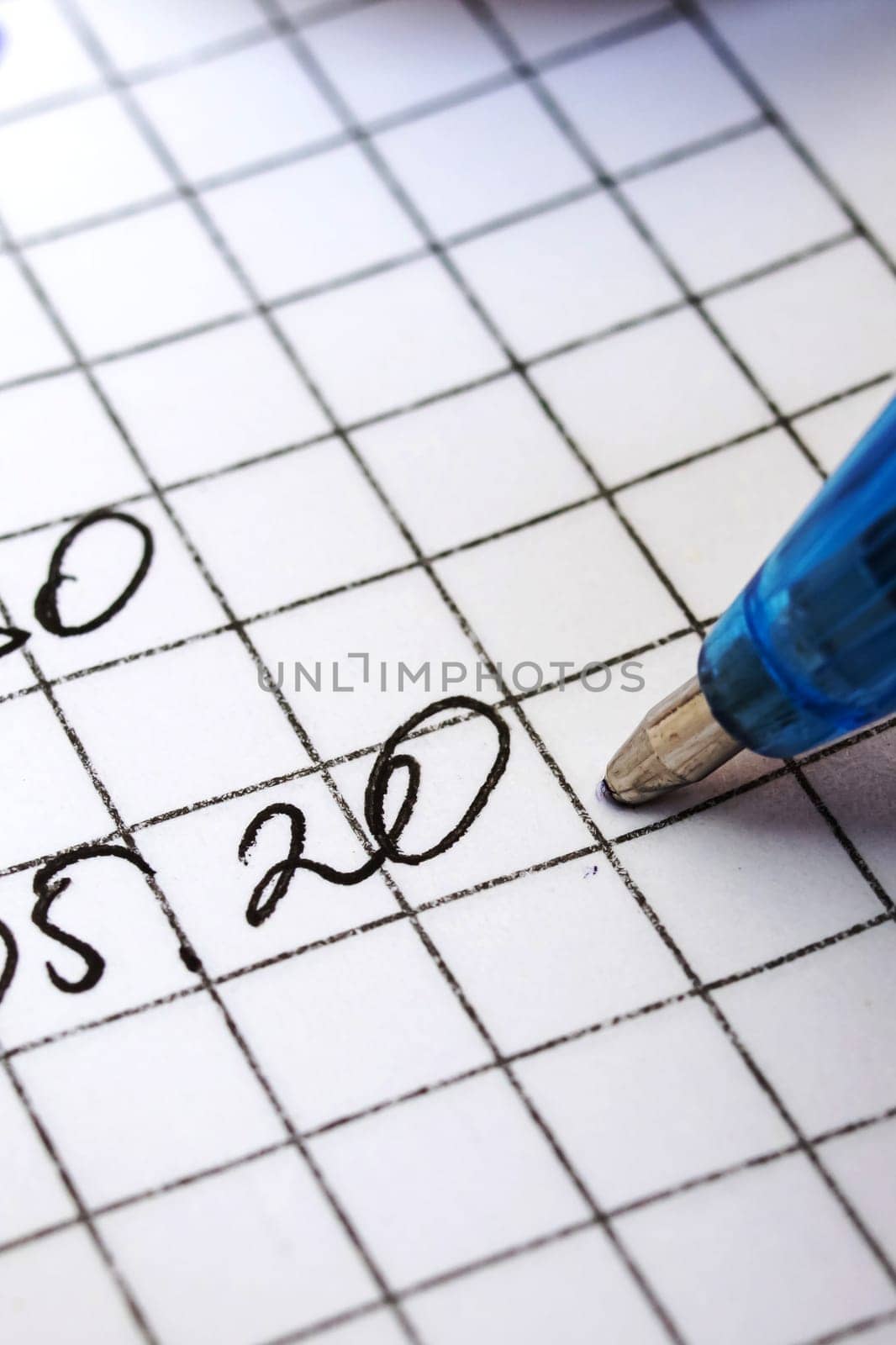 Writing date with pen on white paper close up