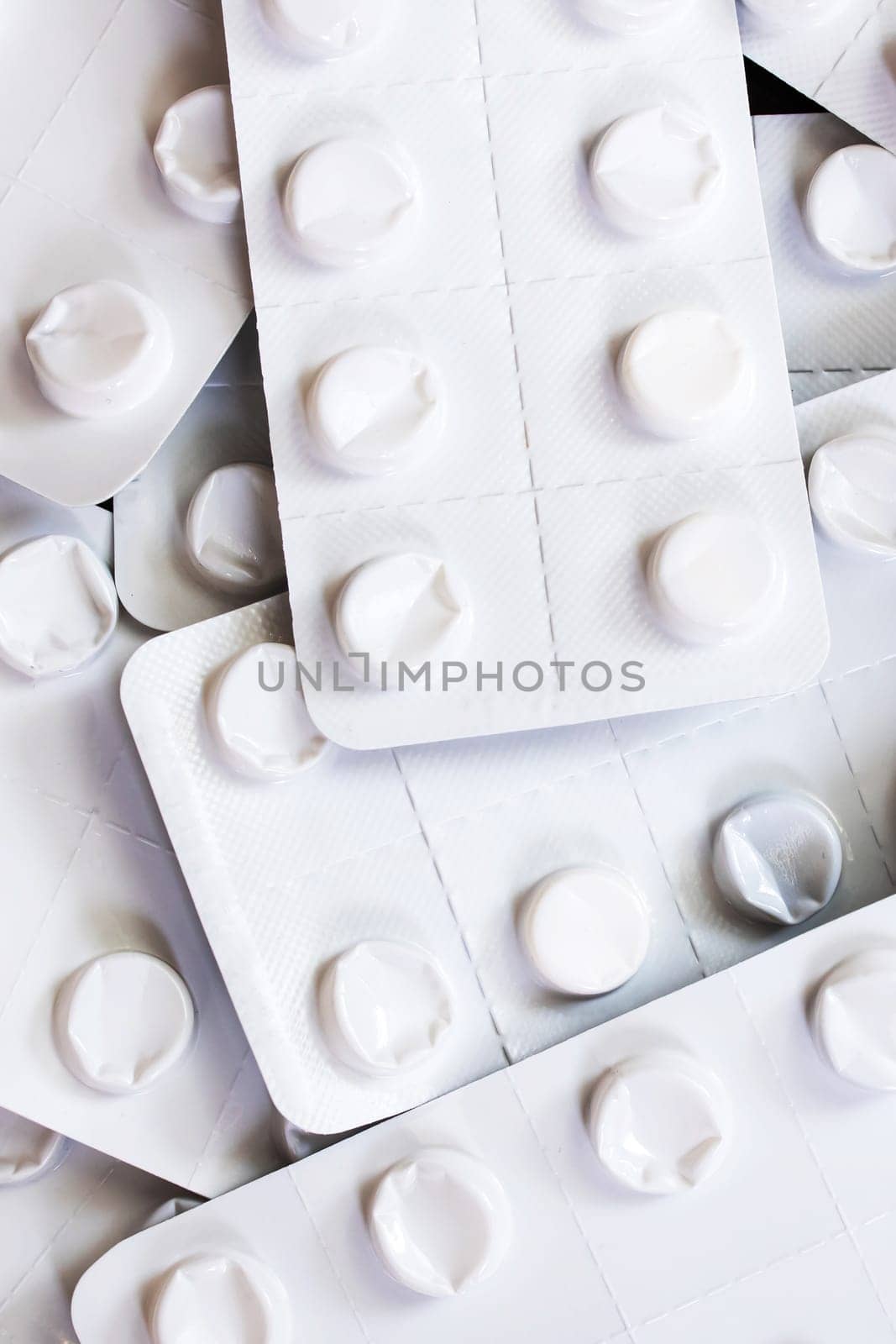 White pill packs close up, background or texture