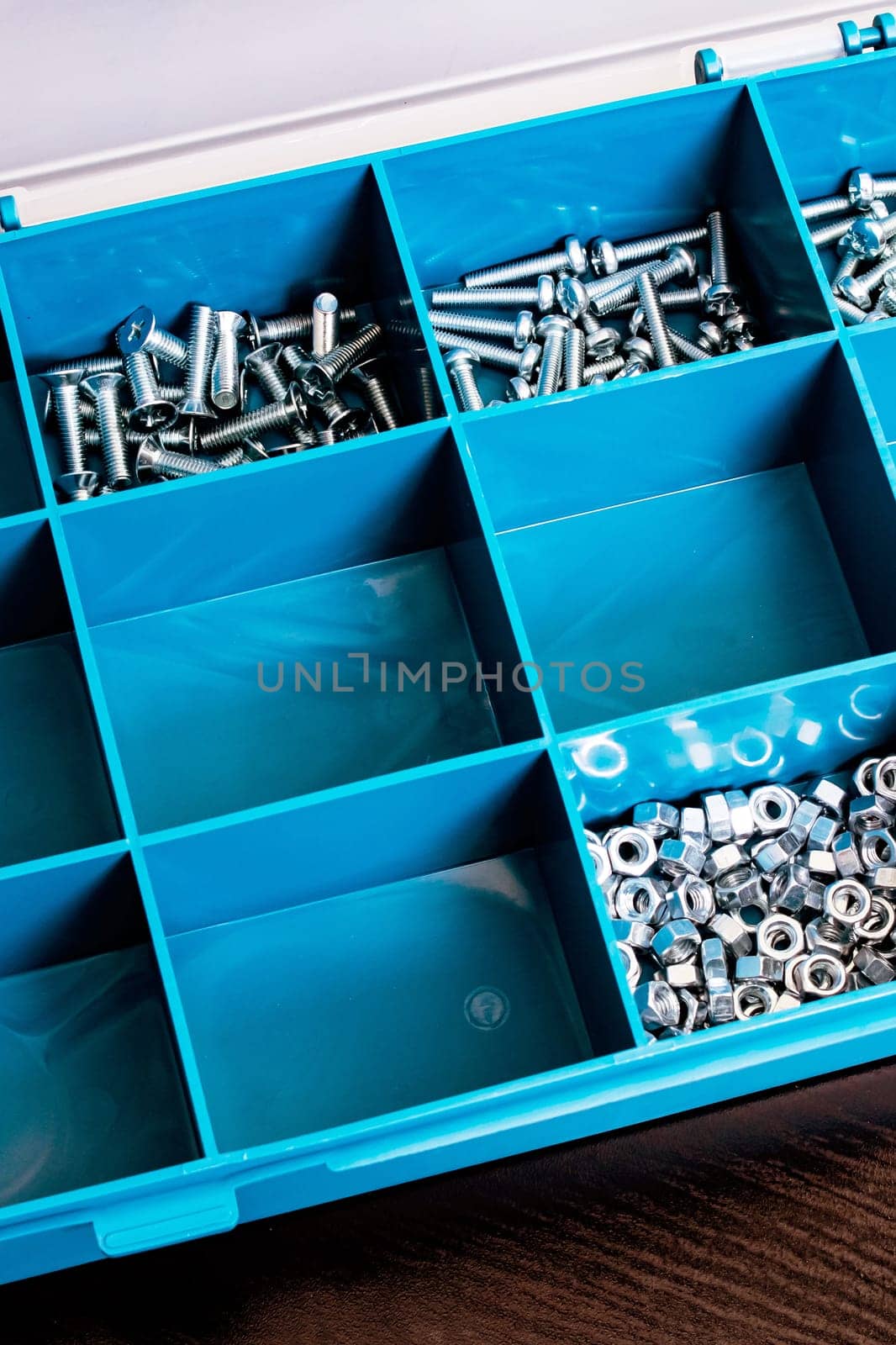 Plastic box with cells on a wooden table