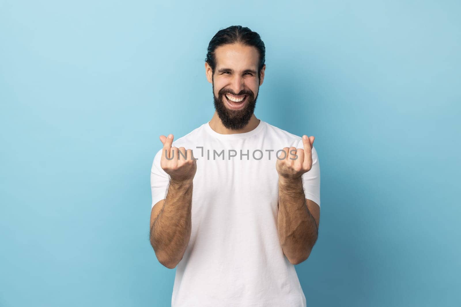 Man wearing white T-shirt hair makes korean like sign mini hear gesture snaps fingers. by Khosro1