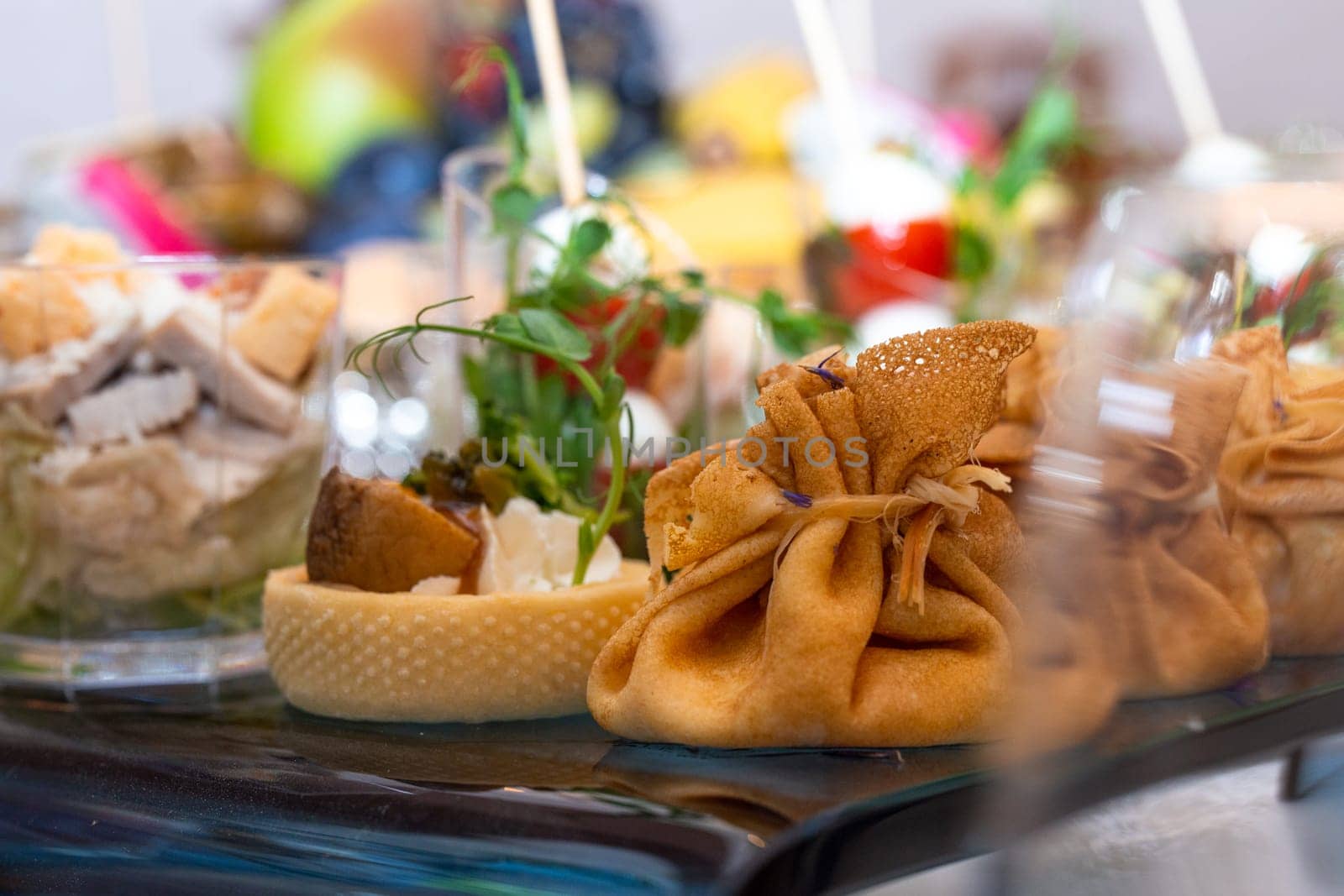 pancake bag with filling on the buffet table with snacks.