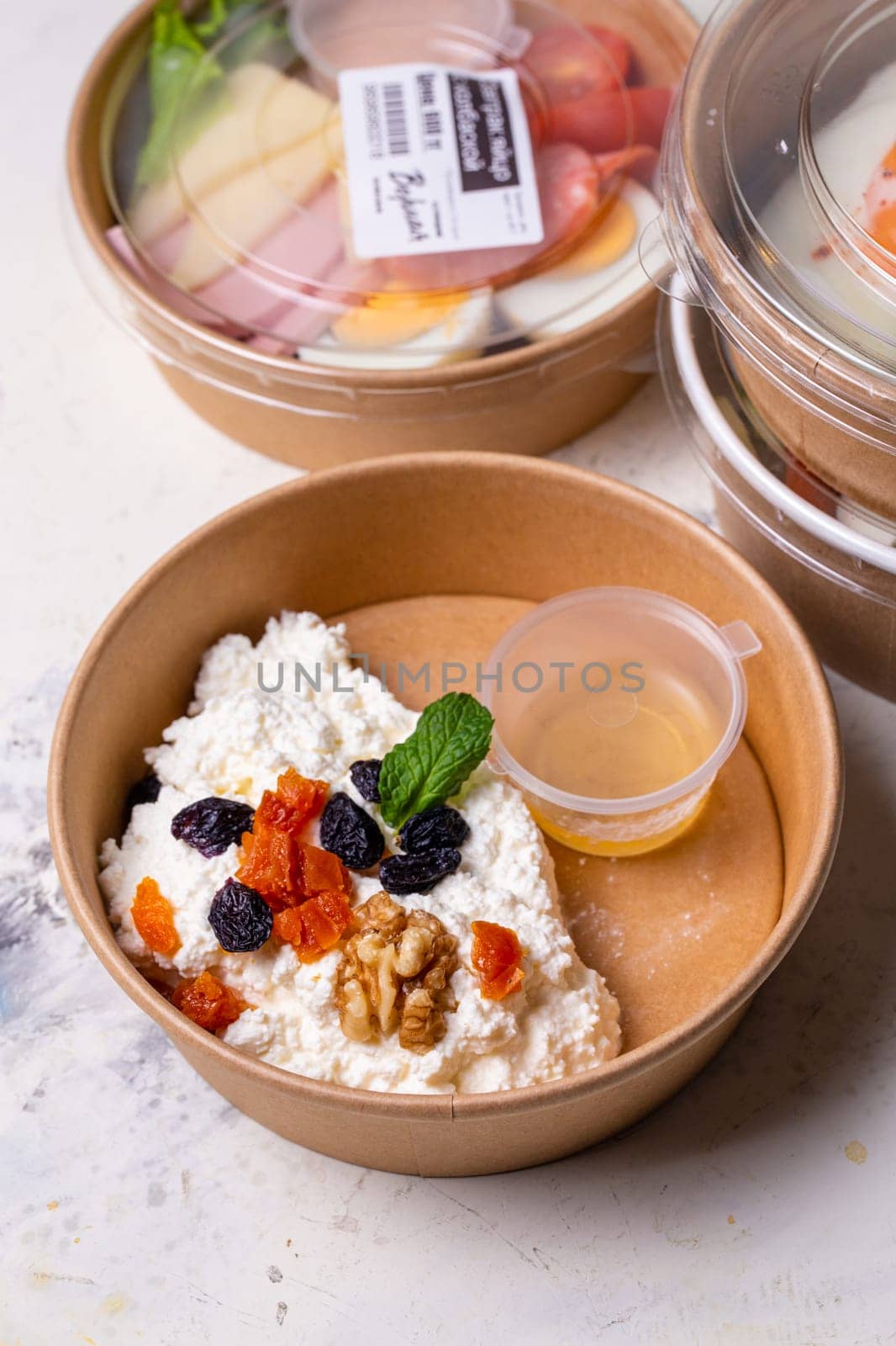 Breakfast cottage cheese with dried fruits top view. tomorrow in craft dishes.