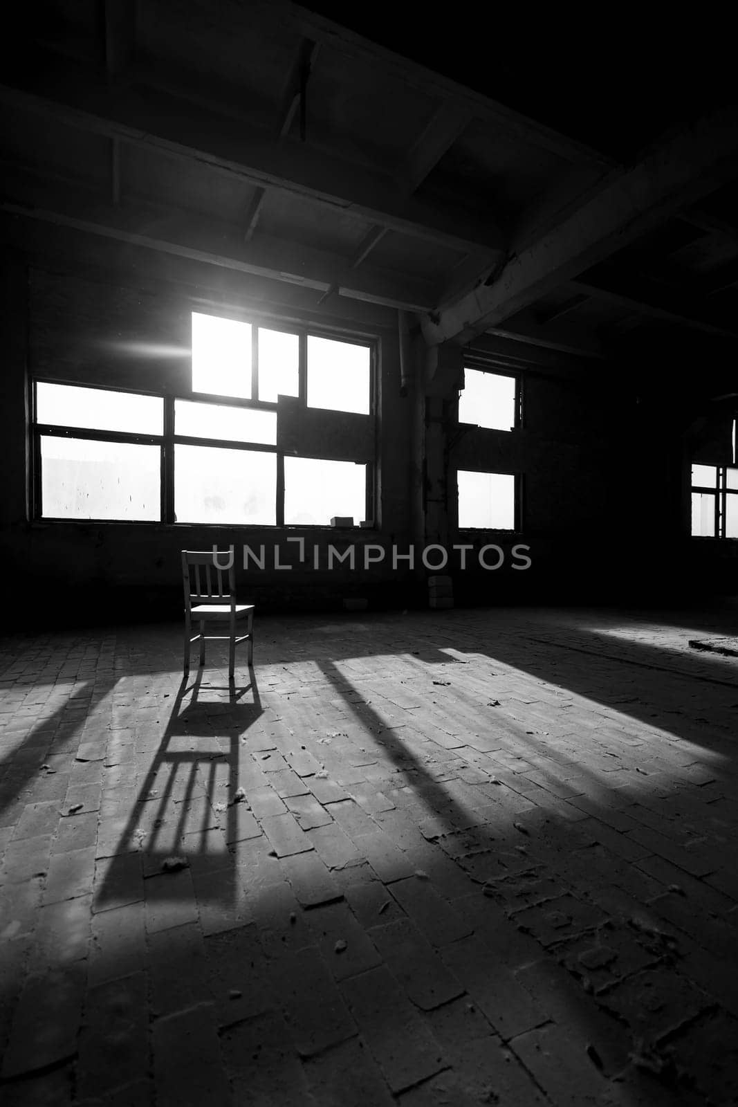Black and white photo of abandoned building interior. by sarymsakov