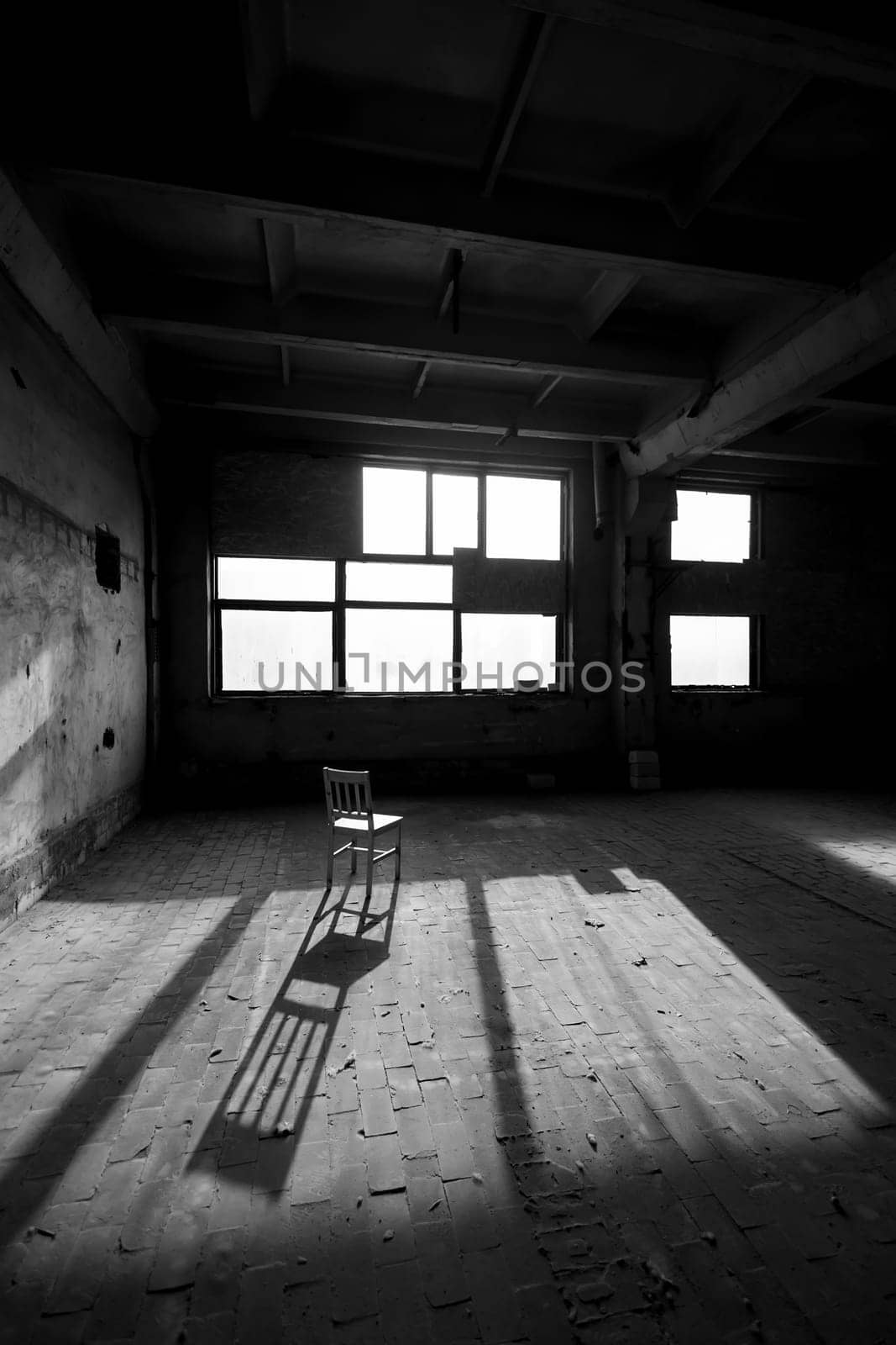 Black and white photo of abandoned building interior. by sarymsakov