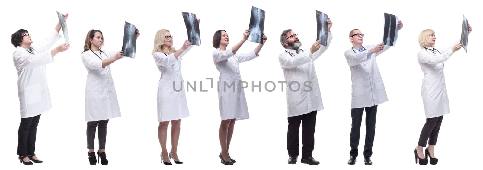 group of doctors holding x-ray isolated on white background