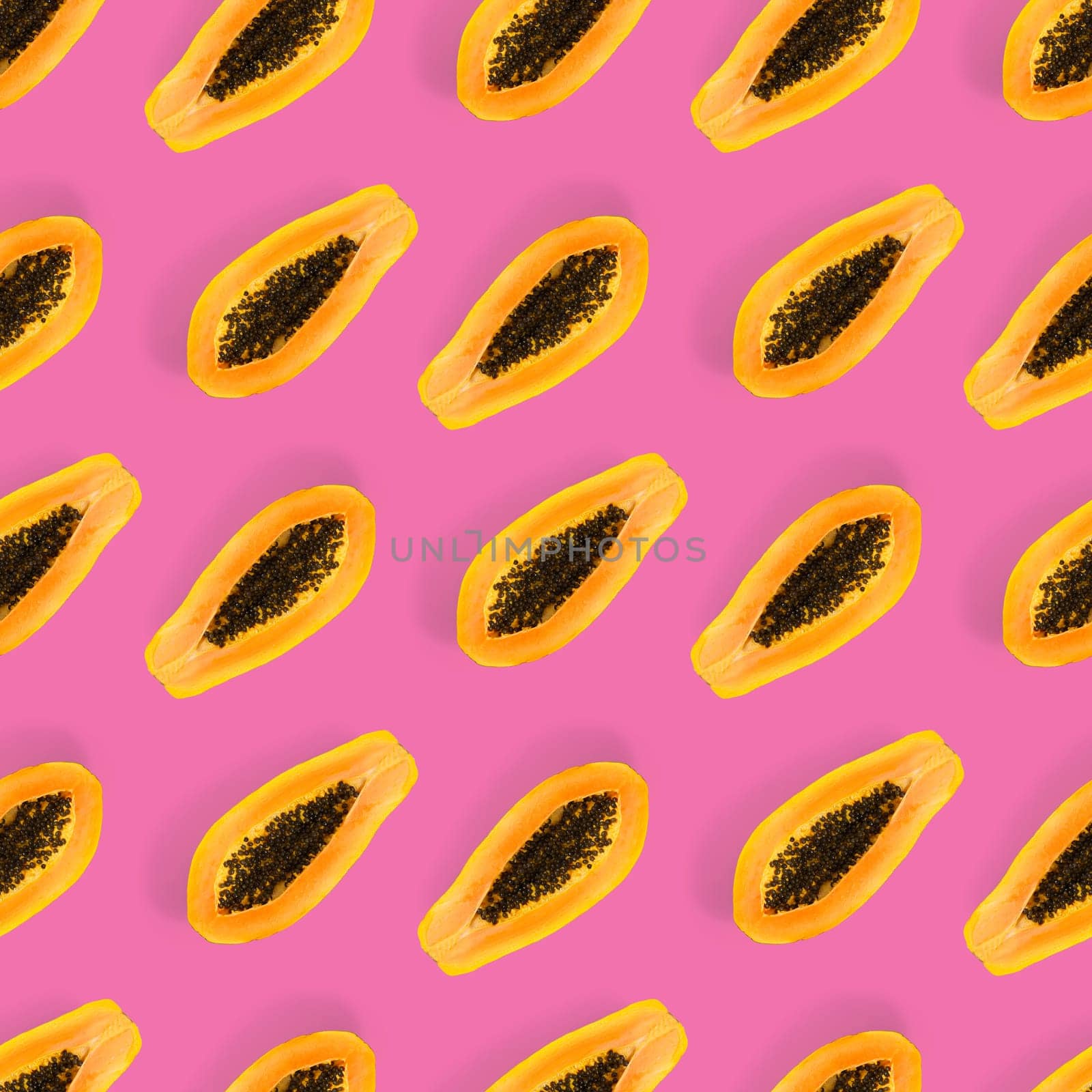 Fresh ripe papaya seamless pattern on pink background. Tropical abstract background. Top view. by PhotoTime
