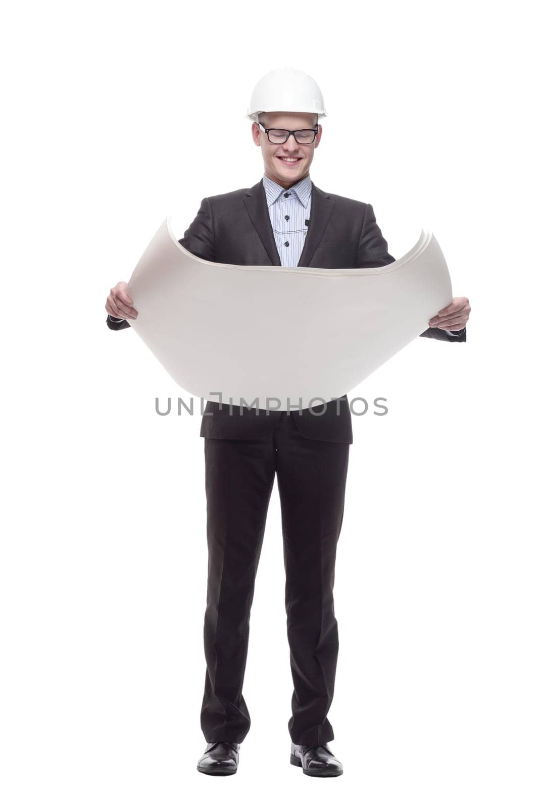 in full growth. young architect with drawings. isolated on a white background.