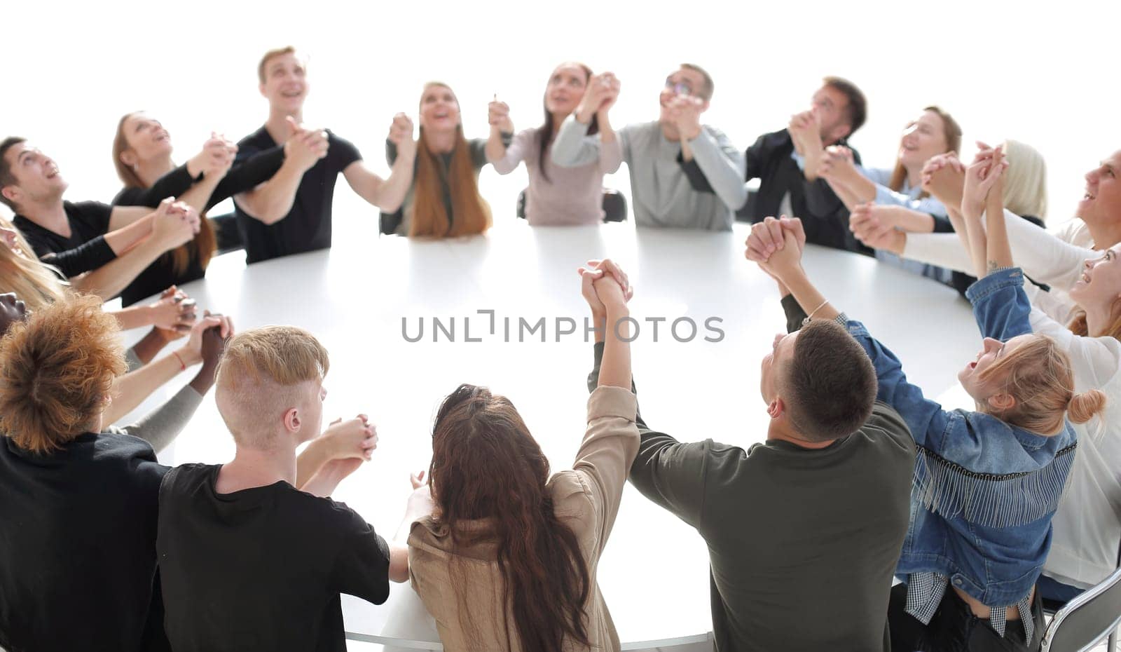 group of young people holding each other's hands . photo with copy space