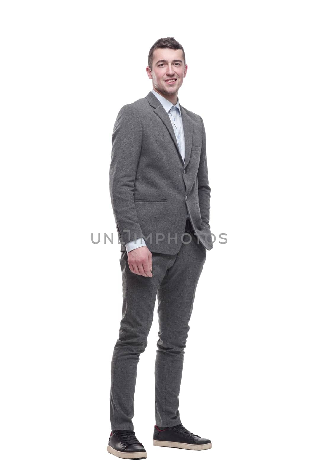 in full growth. a handsome young business man. isolated on a white background.
