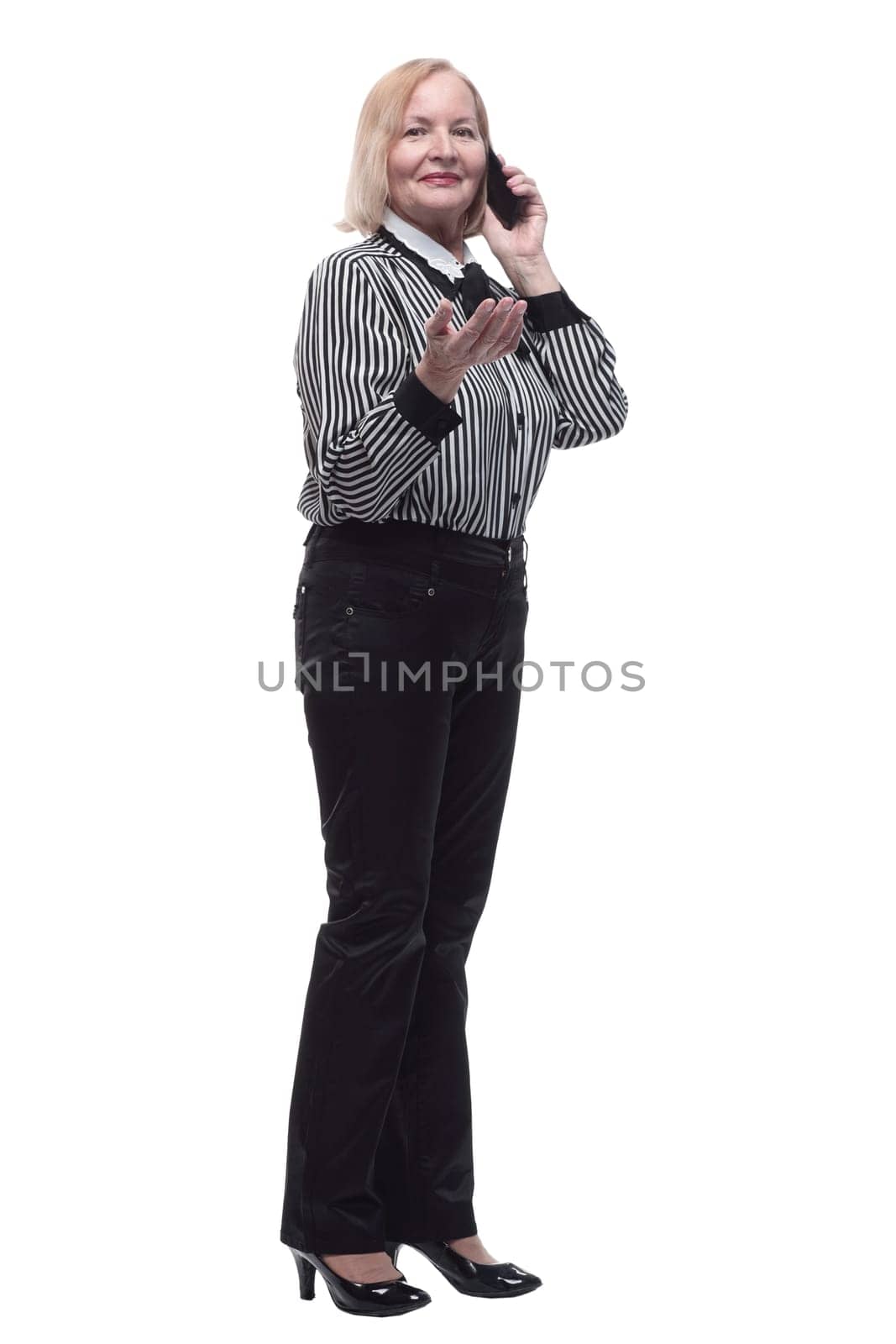 in full growth. Executive business woman with a smartphone. isolated on a white background.