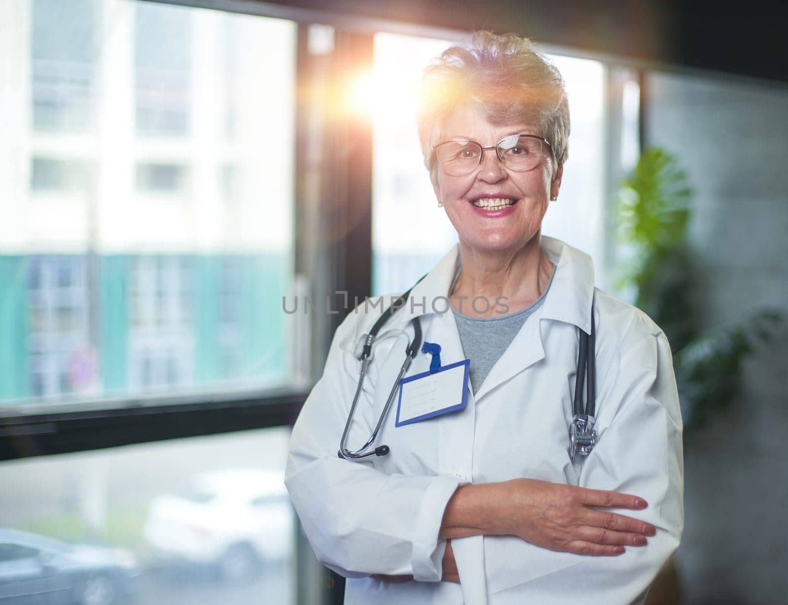 Friendly mature female doctor at hospital smiling