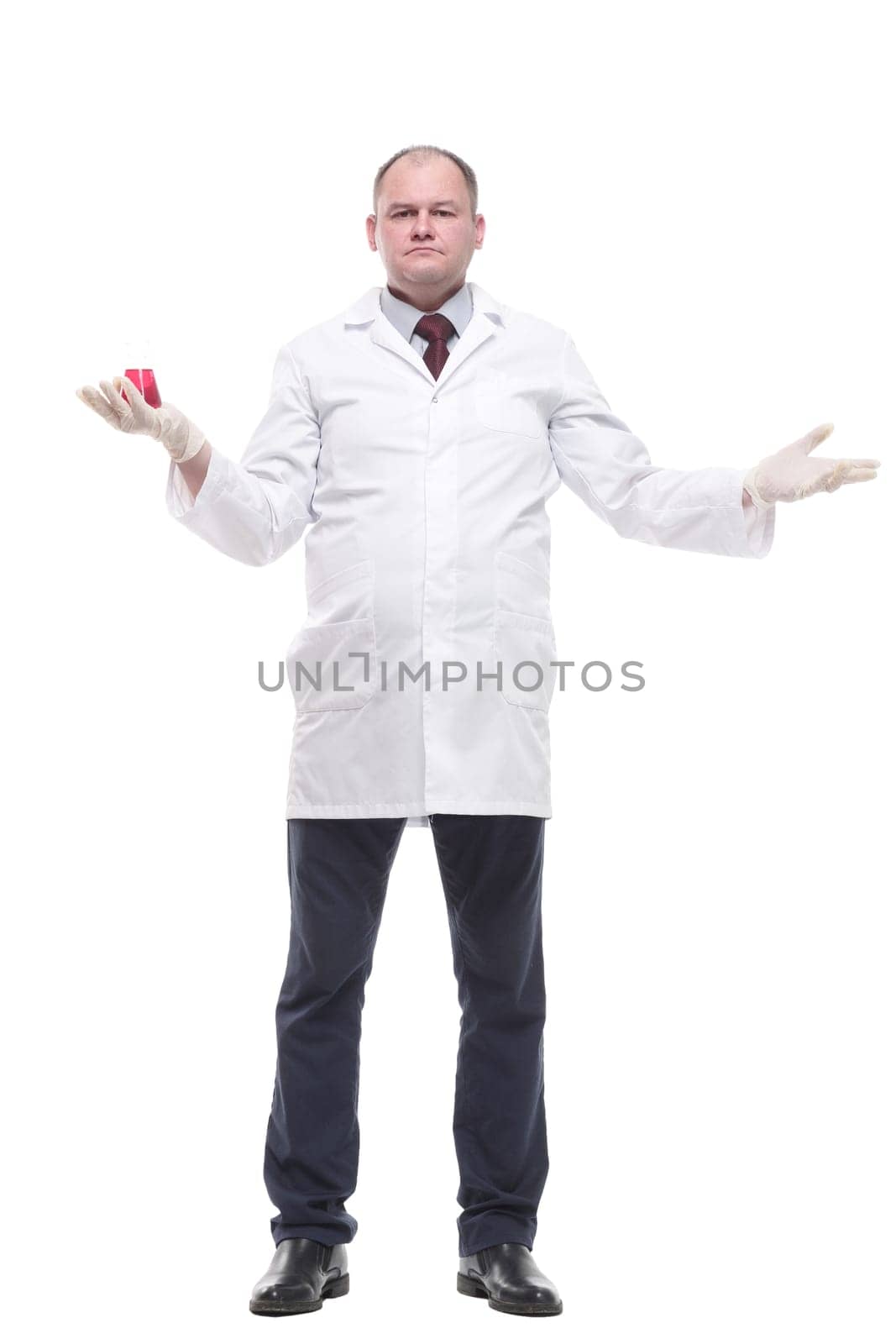 in full growth. researcher with a laboratory flask in his hands. isolated on a white background.