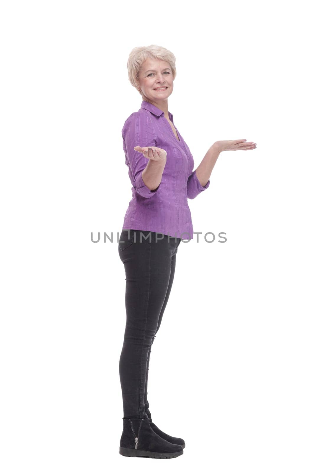 in full growth. attractive mature woman in casual clothing. isolated on a white background.