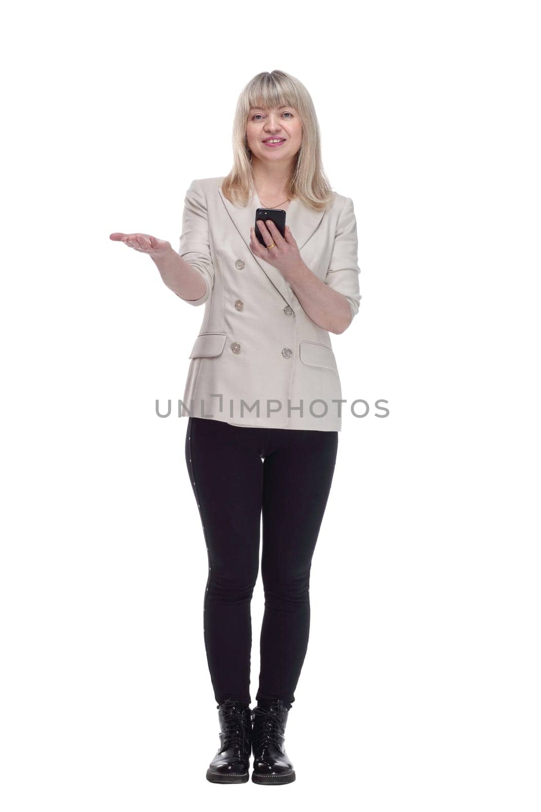 in full growth. attractive woman reading message on her smartphone . isolated on a white background.